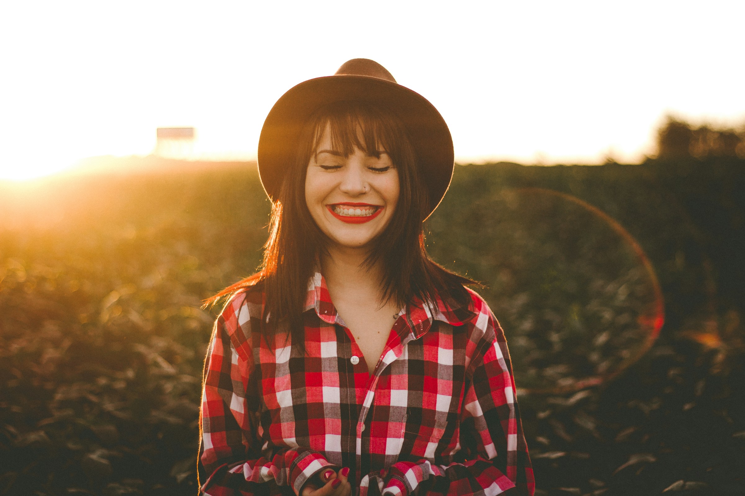 A woman laughing | Source: Unsplash