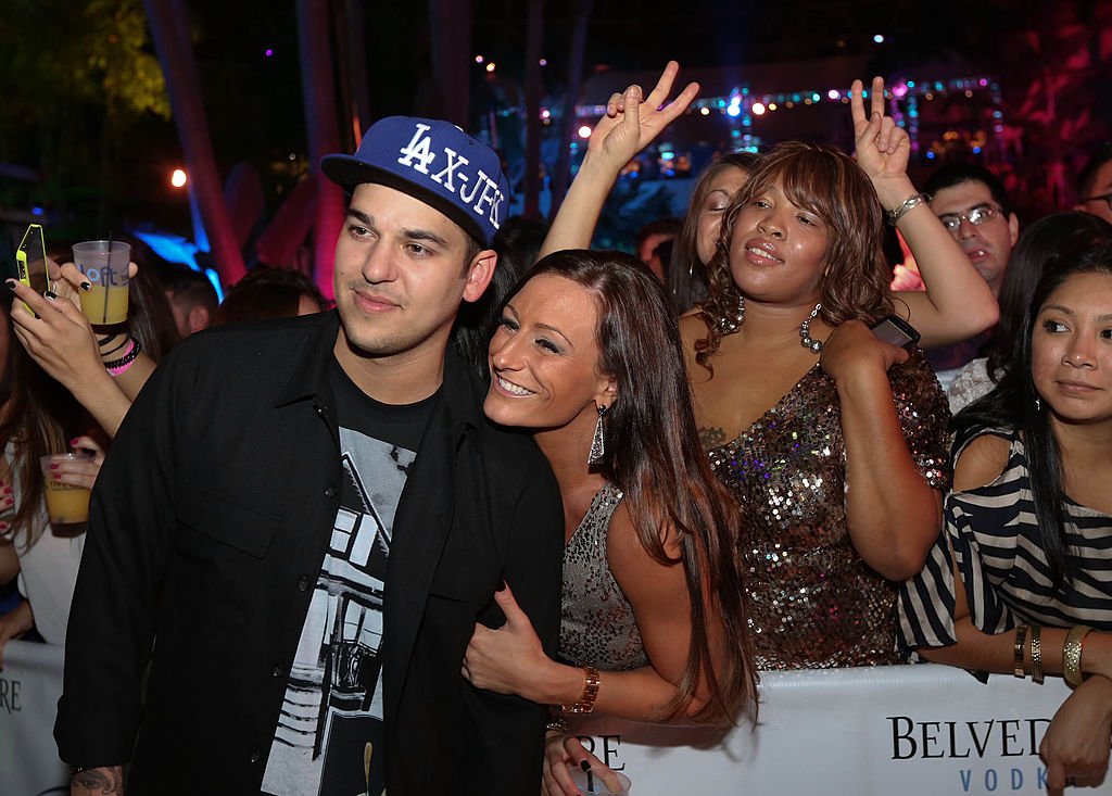 Rob Kardashian poses with fans while hosting The Pool After Dark at Harrah's Resort, September 2012 | Source: Getty Images