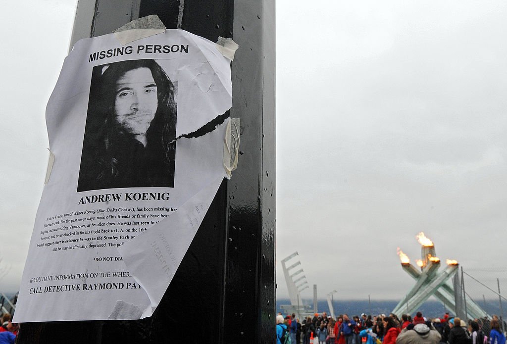  A missing persons poster for actor Andrew Koenig is seen on a light pole in front of the Olympic Cauldron | Getty Images
