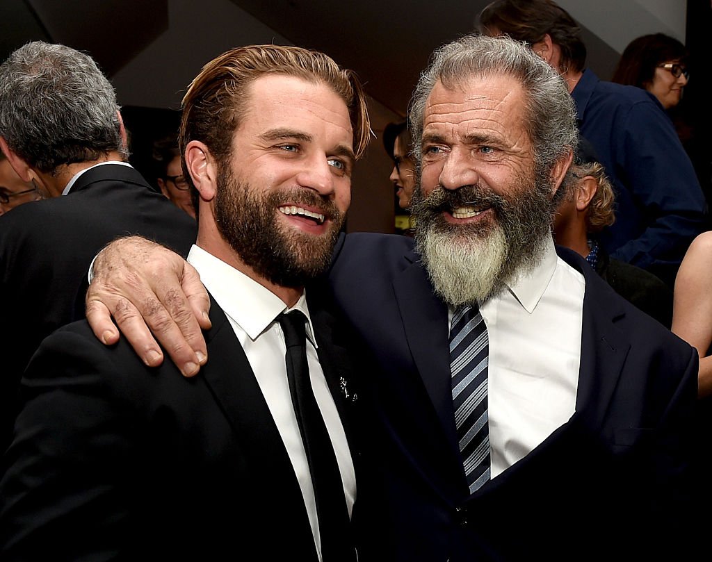 Mel Gibson (R) and his son actor Milo Gibson pose at the after party for a screening of Summit Entertainment's "Hacksaw Ridge" at the Academy of Motion Picture Arts and Sciences on October 24, 2016, in Beverly Hills, California. | Source: Getty Images.