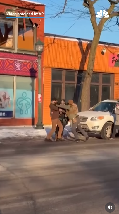 Federal agents confront a man on a snowy Minneapolis street during an immigration enforcement action | Source: Instagram/nbcchicago | AP