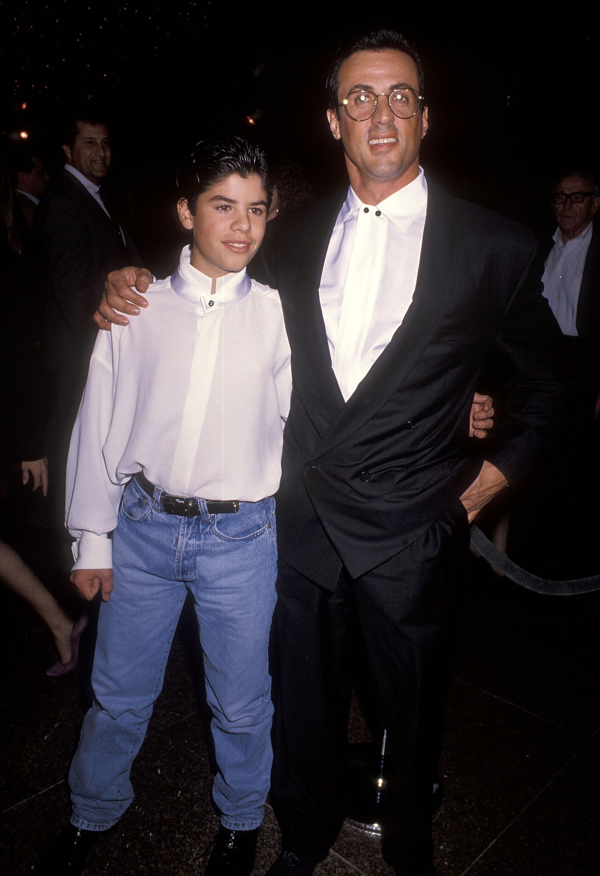The boy and his father at the "Rocky V" premiere in West Hollywood, California, on November 13, 1990 | Source: Getty Images