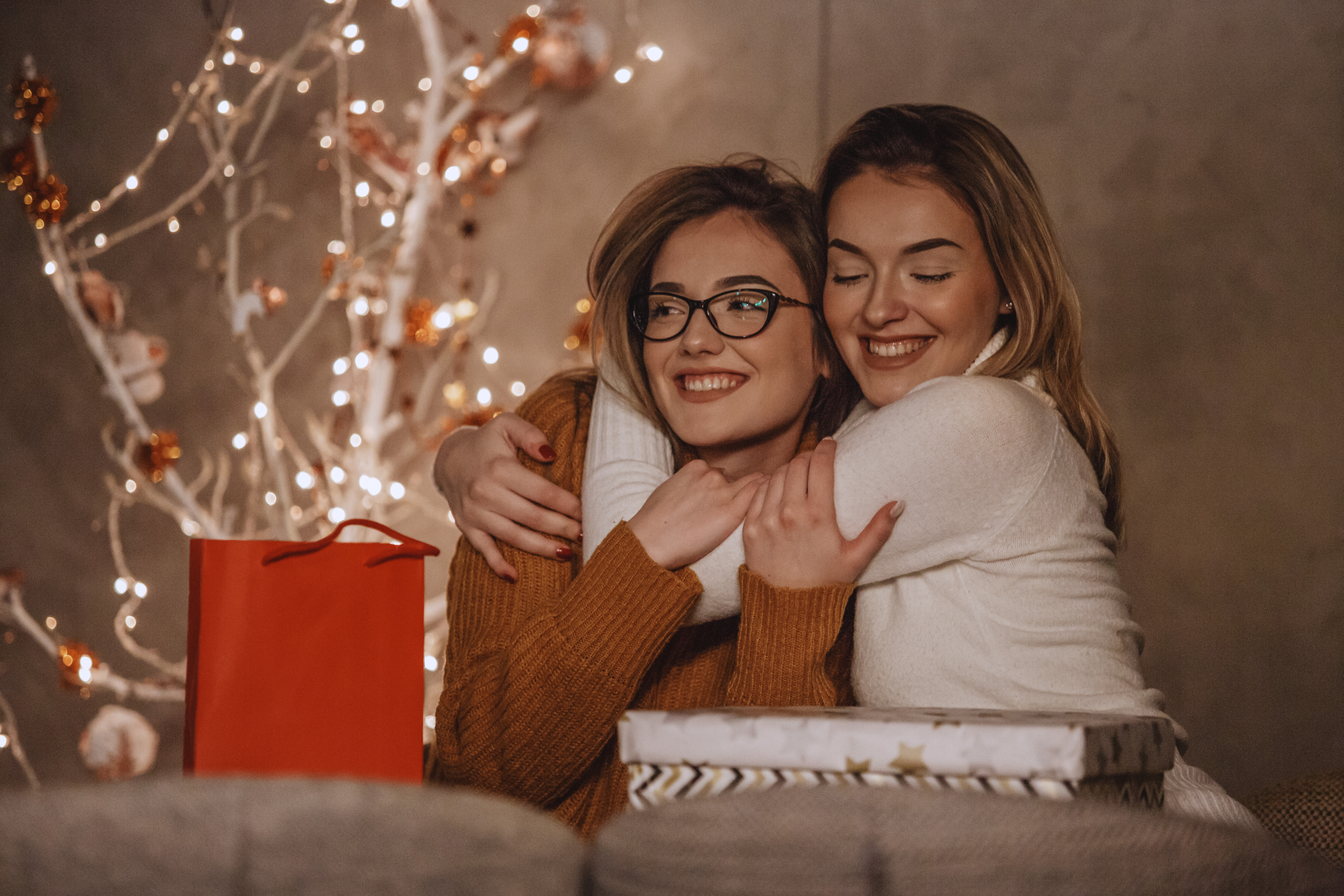 Two sisters celebrating Christmas together | Source: Getty Images