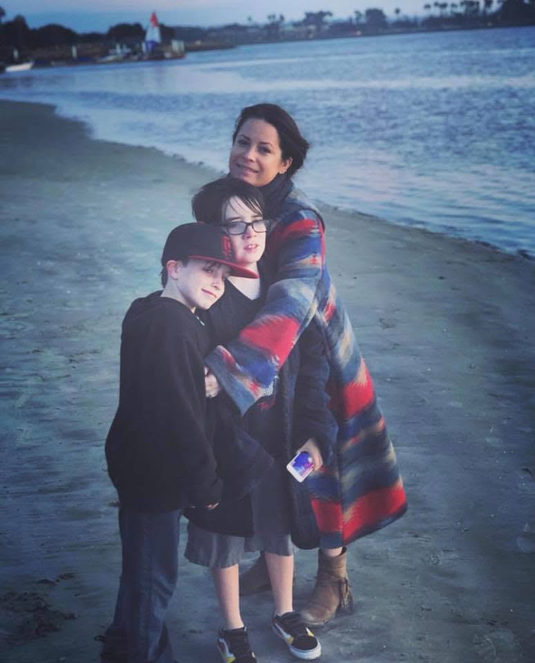 This beach photo feels like a soft pause in the middle of a very public life. It shows why Combs' later love story mattered: it did not replace motherhood; it entered a life already full of it. | Source: Facebook/Holly Marie Combs