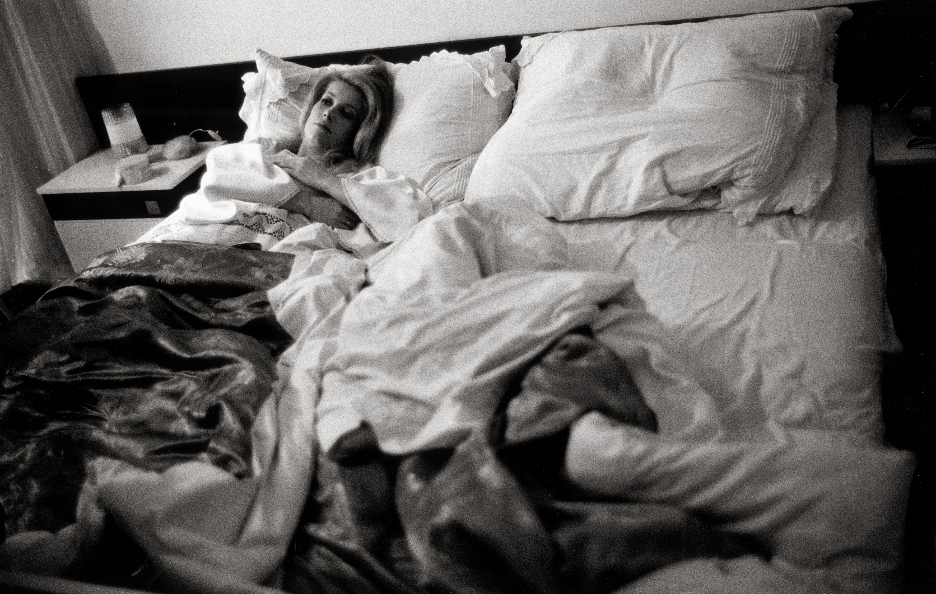 The French actress is seen lying in bed while shooting a movie in Vienna, Austria, circa 1964. | Source: Getty Images