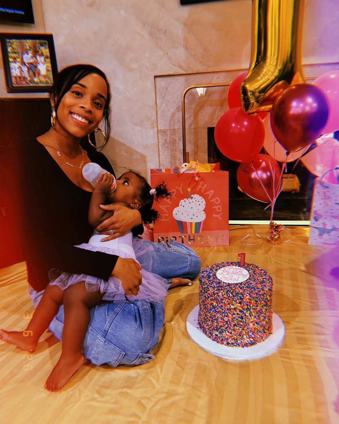 Italia Smith with her daughter Lael, posted on Lael's 1st birthday on March 11, 2026 | Source: Instagram/sislovespurple
