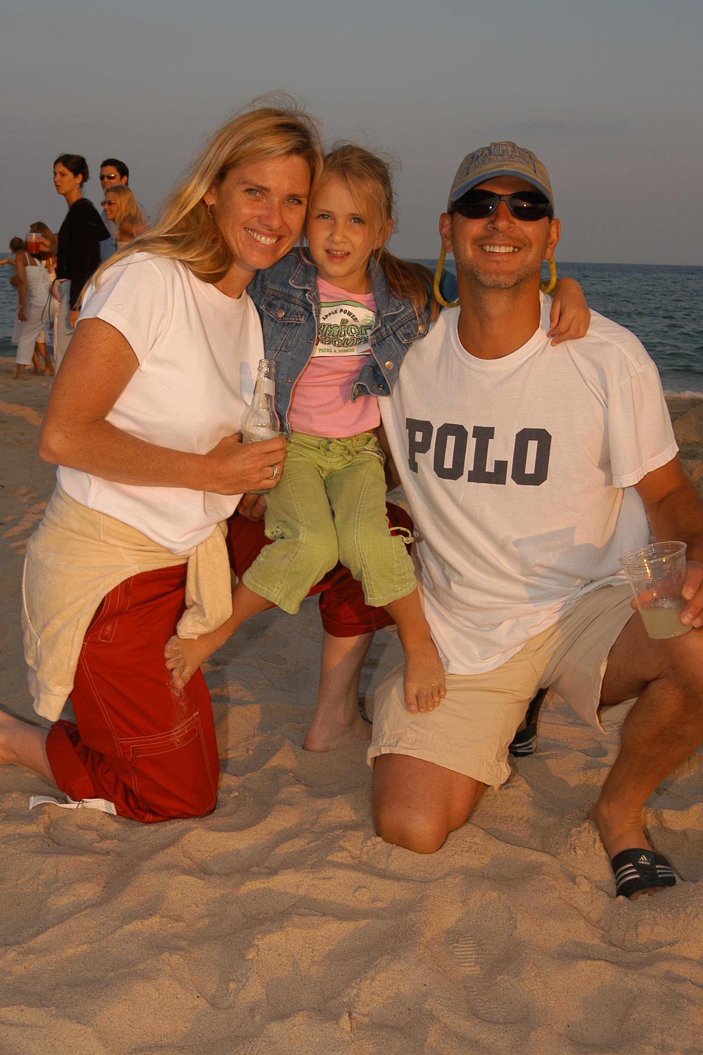 Ron, Abigail Galotti and Lisa Wilcox attend Hamptons Magazine's Annual Clambake on July 11, 2004, in Watermill, New York. | Source: Getty Images