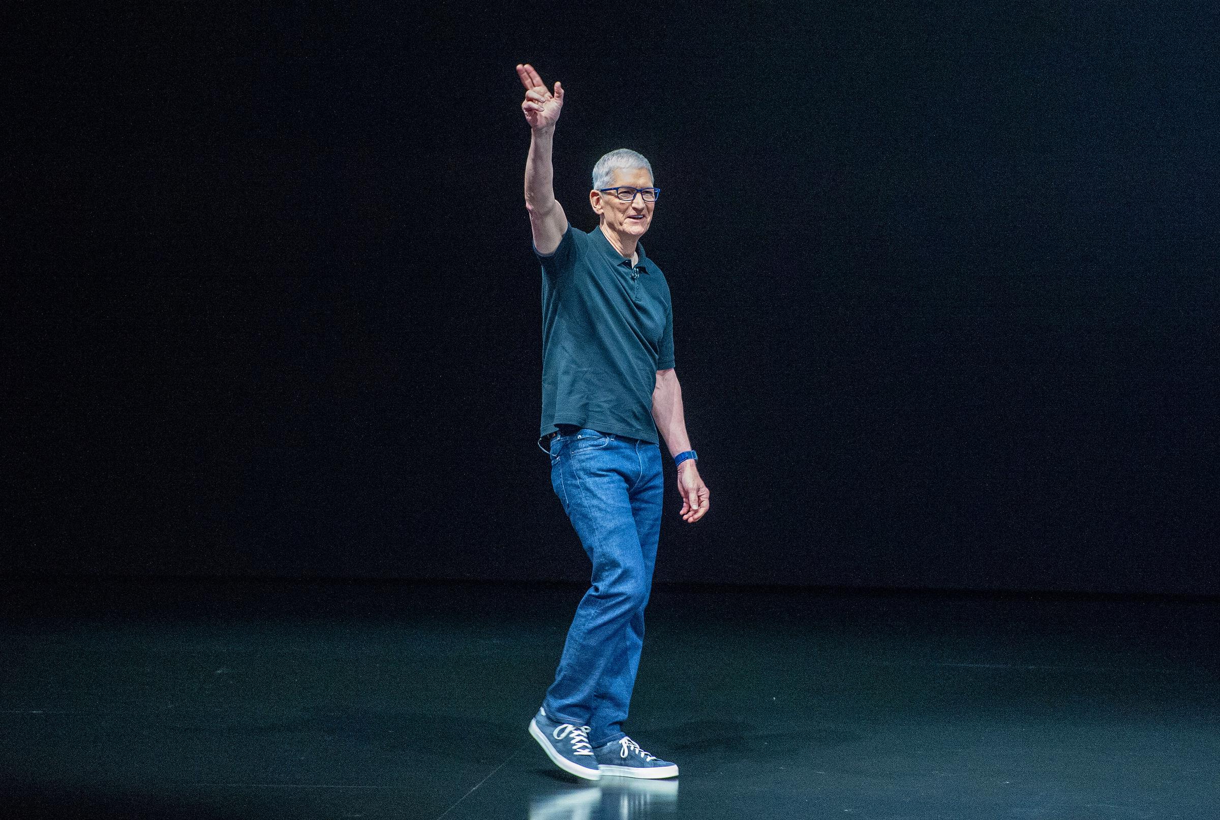 Tim Cook waves before the presentation of new iPhone models on September 9, 2025 in Cupertino | Source: Getty Images