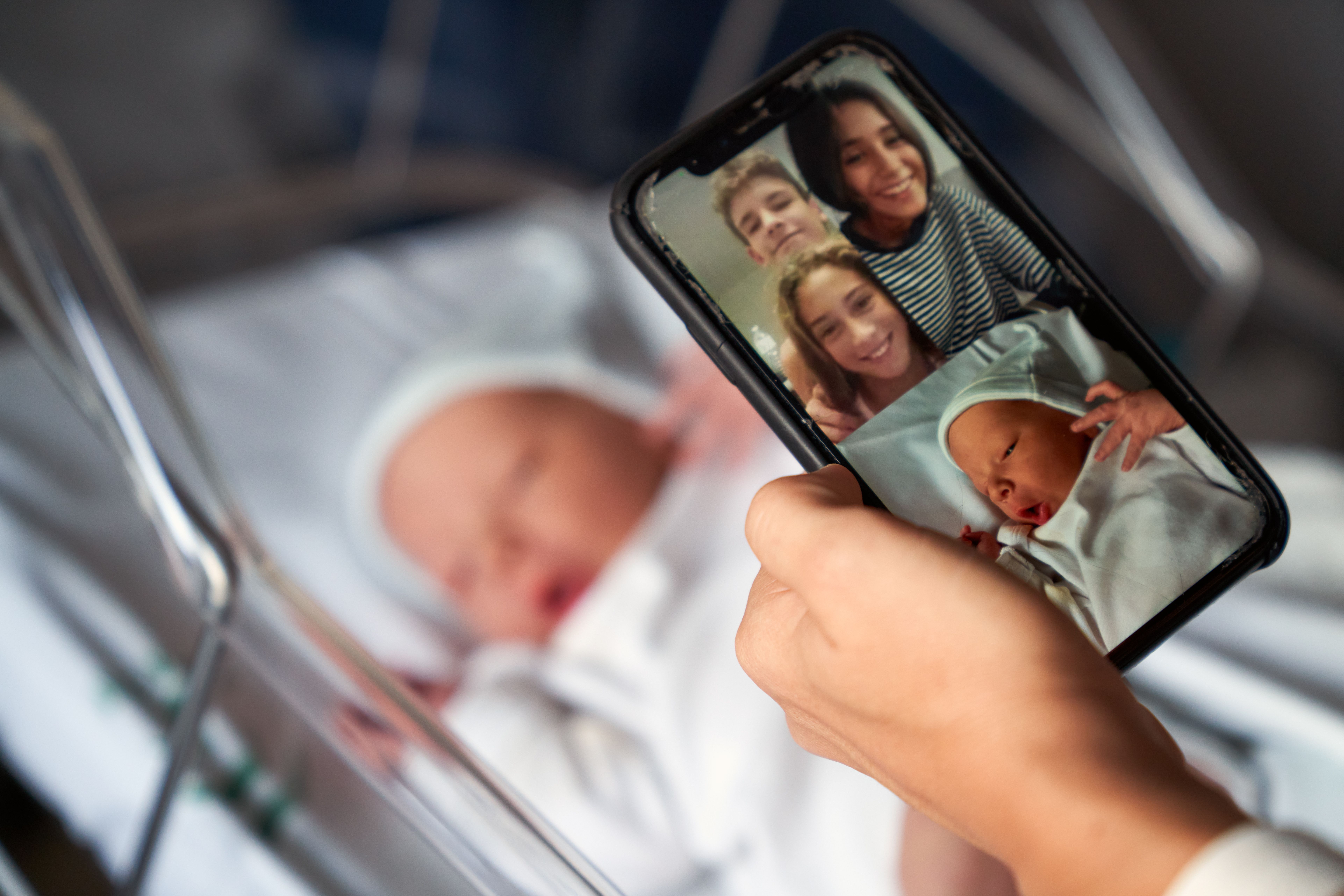 A newborn child on video call. | Source: Getty Images