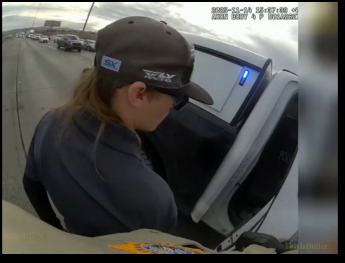 Tyler Johns is being taken away in the police vehicle, as seen from a the bodycam footage dated November 22, 2025. | Source: Facebook Reel/Thisisbutter