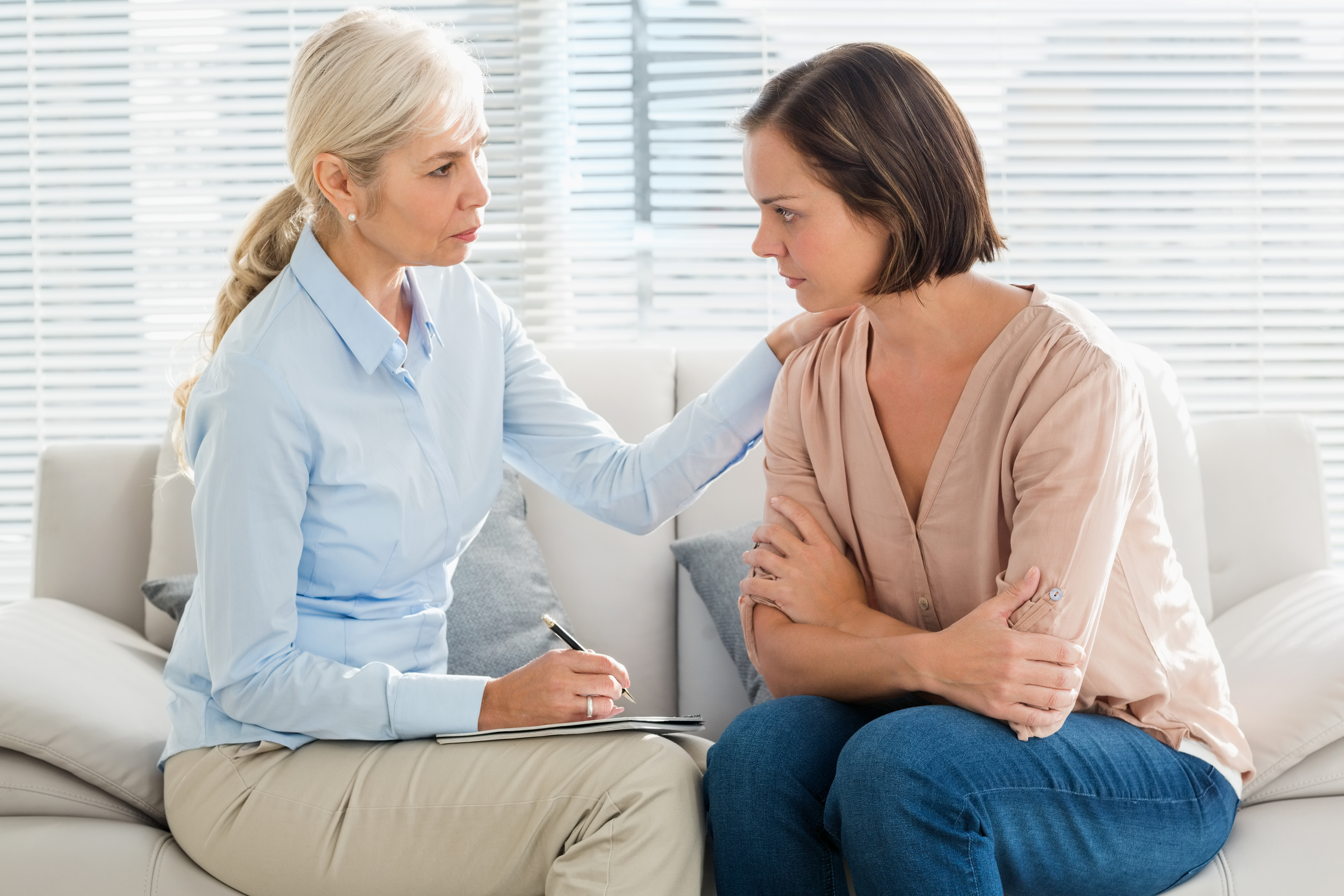 Therapist speaks to a client | Source: Getty images