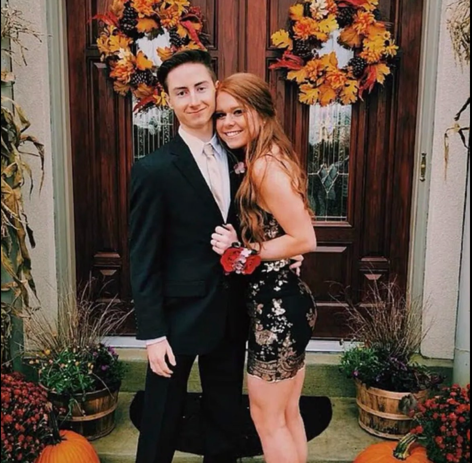 Madeline Spatafore and Ryan Hosso pose together dressed formally in front of a decorated doorway. | Source: Facebook/Mark Dohner﻿