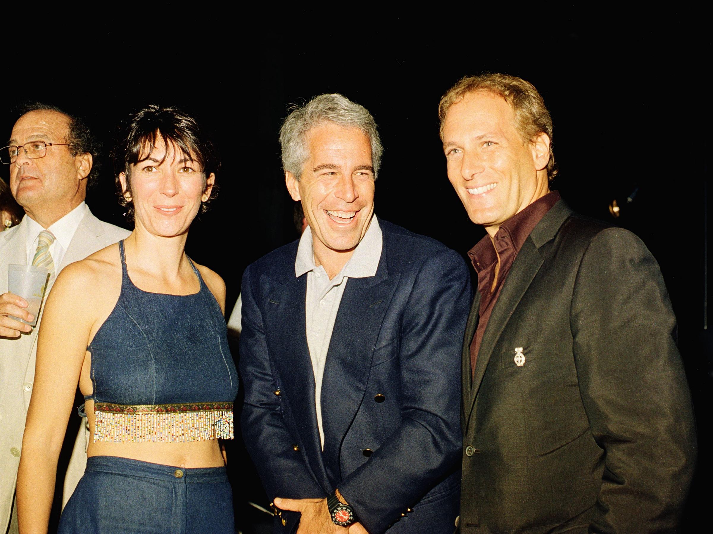 (L-R) Ghislaine Maxwell, Jeffrey Epstein, and musician Michael Bolton pose for a portrait during a party at the Mar-a-Lago club, Palm Beach, Florida, on February 12, 2000 | Source: Getty Images