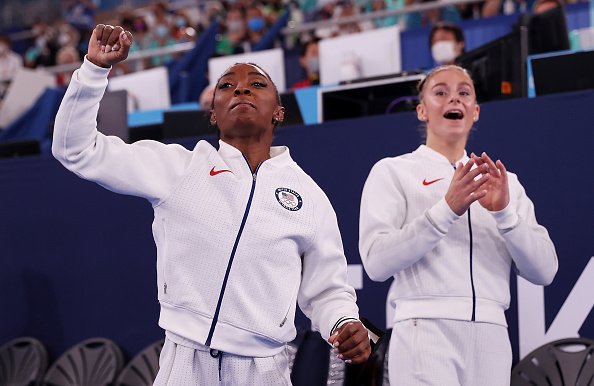 Simone Biles and Grace McCallum of Team United States cheer during the Women's Team Final on day four of the Tokyo 2020 Olympic Games | Source: Getty Images