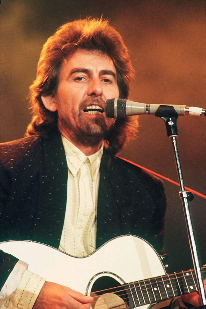 George Harrison performs on stage at Prince's Trust concert | Getty Images / Global Images Ukraine George Harrison performs on stage at Prince's Trust concert | Getty Images / Global Images Ukraine