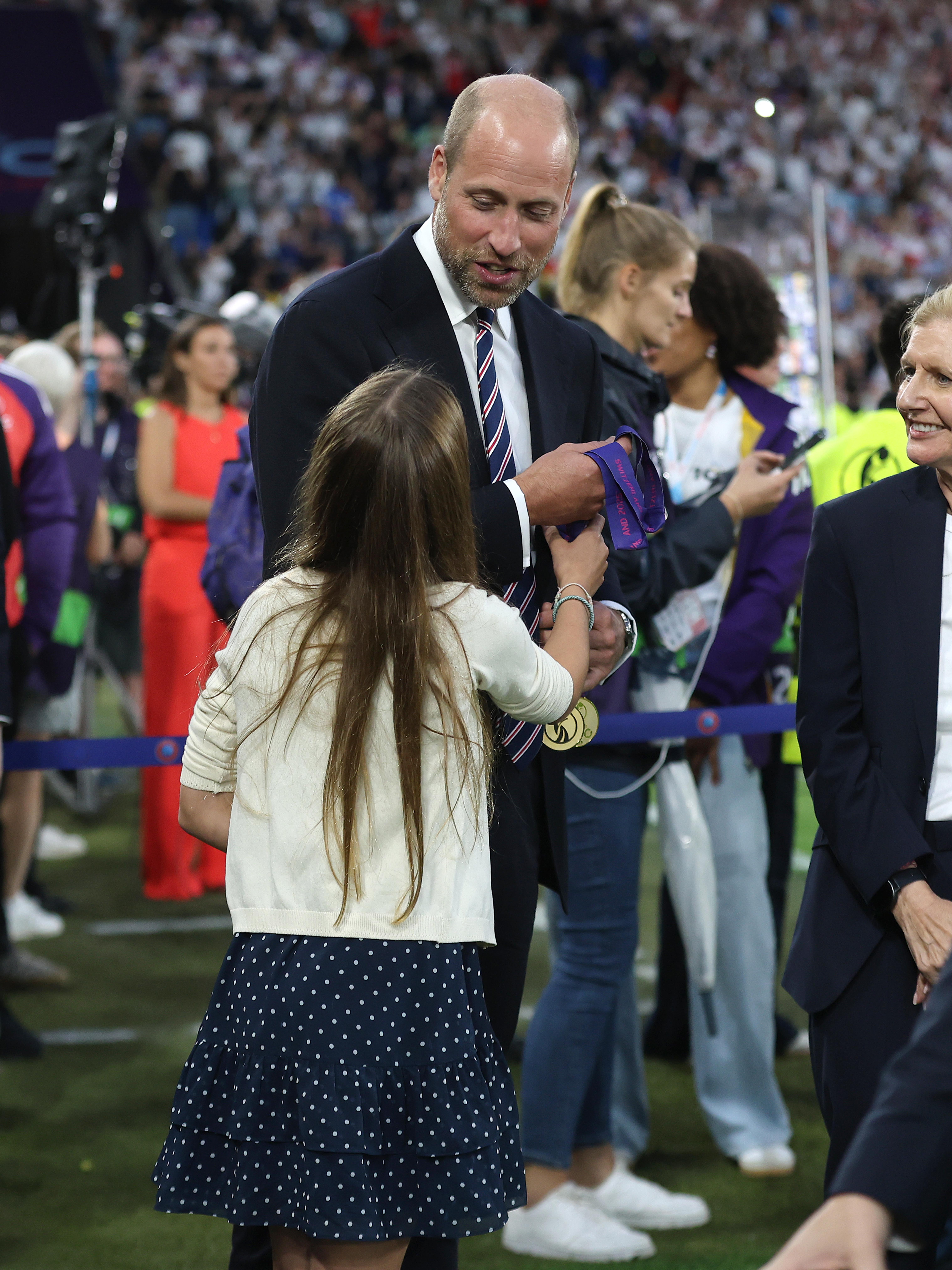 Prince William is given two UEFA Women's Euro 2025 winners' medals along with Princess Charlotte during the UEFA Women's EURO Final match at Switzerland on July 27, 2025 | Source: Getty Images