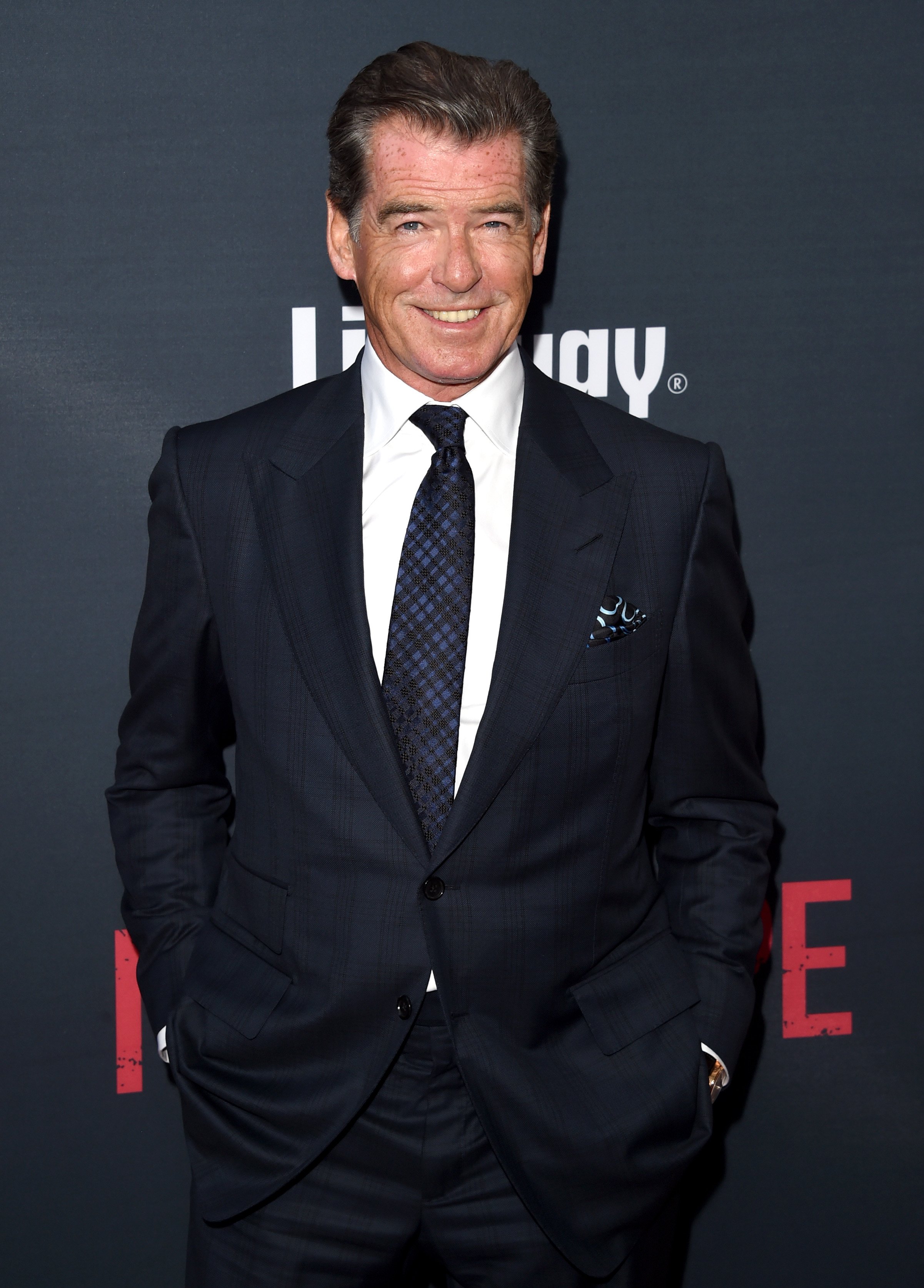 Pierce Brosnan arrives at The Premiere Of The Weinstein Company's "No Escape" at Regal Cinemas L.A. Live on August 17, 2015. | Photo: GettyImages 