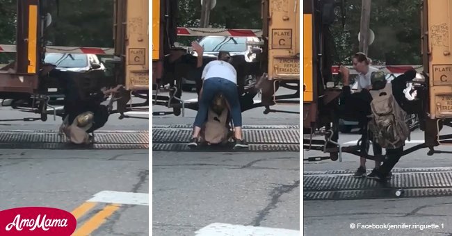 Heroic woman puts herself at risk to rescue a man stuck between two train cars (video)