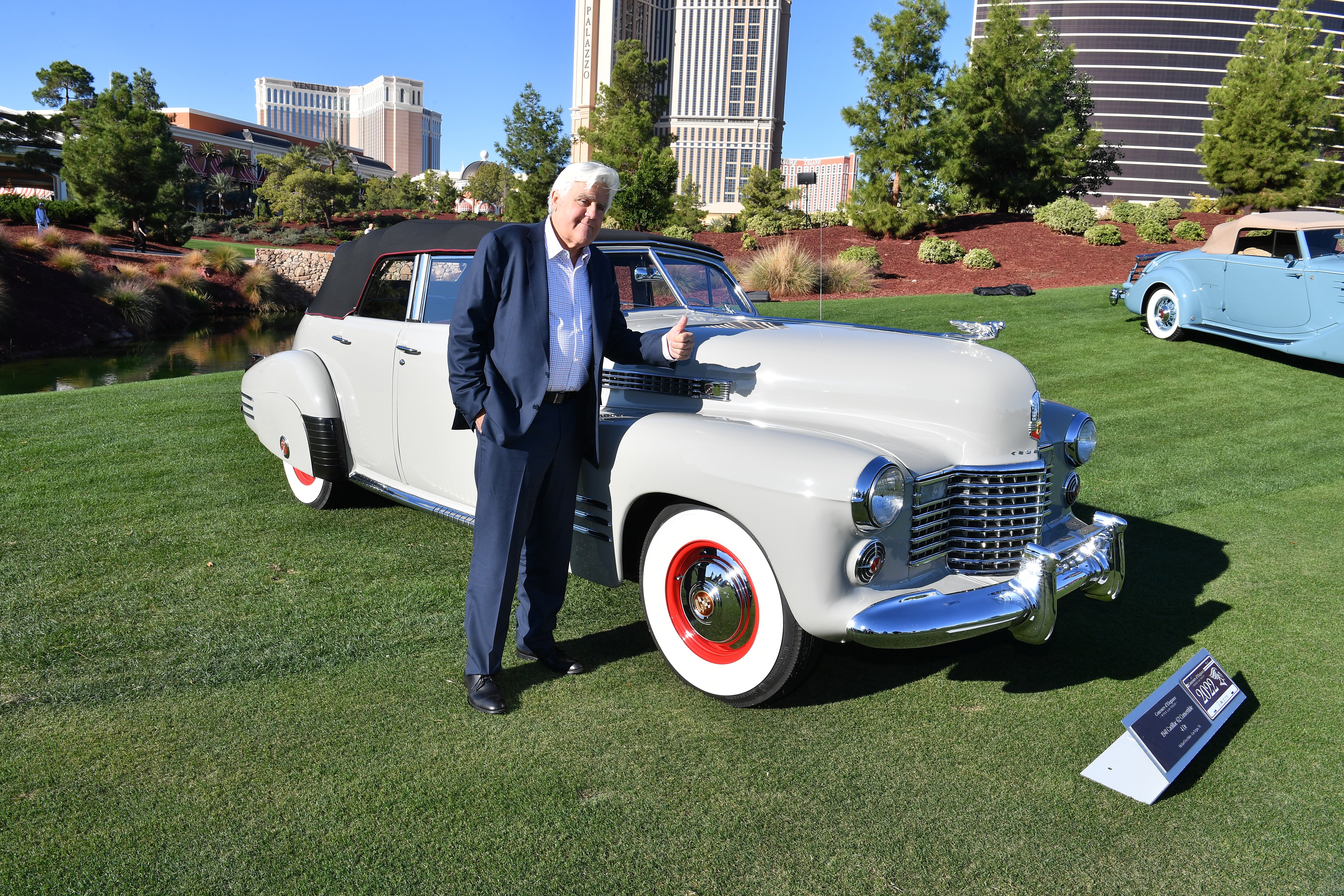 Jay Leno poses with a 1941 Cadillac 62 Convertible 4 Dr at the Las Vegas Concours d'Elegance on October 29, 2022, in Las Vegas, Nevada | Source: Getty Images
