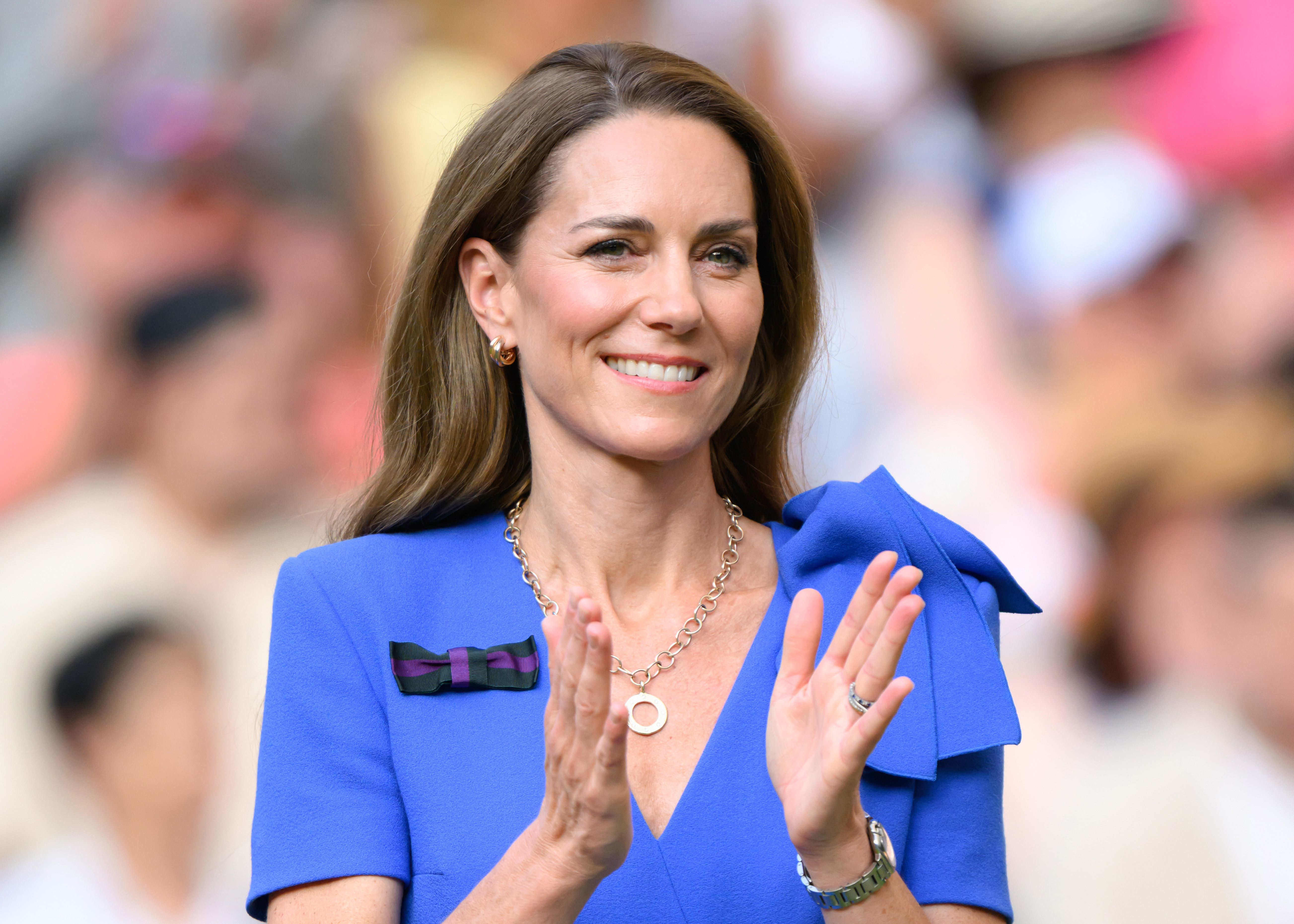Princess Catherine claps with a soft smile as the Wimbledon award ceremony continues. Her expression remains gracious, capturing the poise she carried throughout the event.