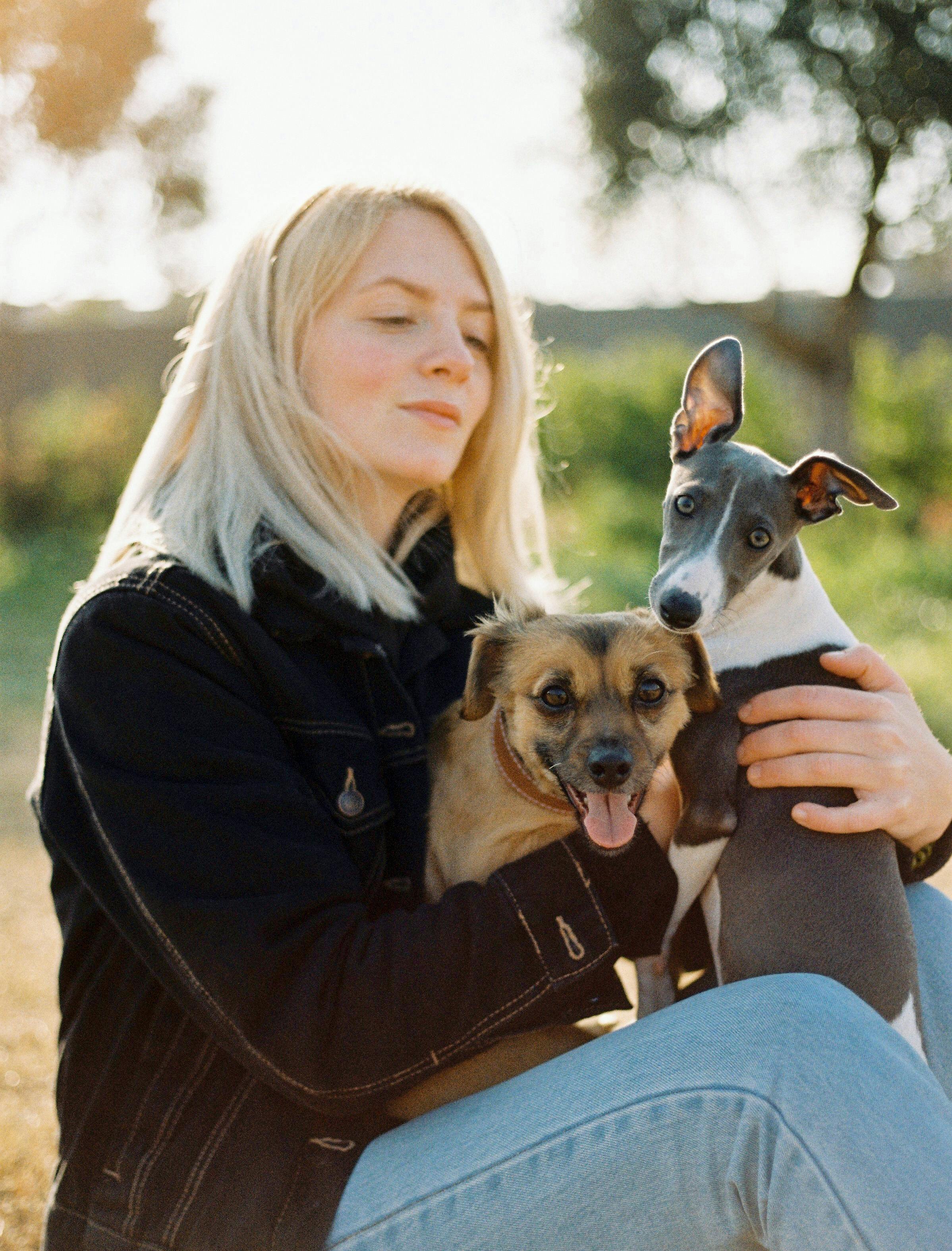 A woman with her dogs | Source: Pexels