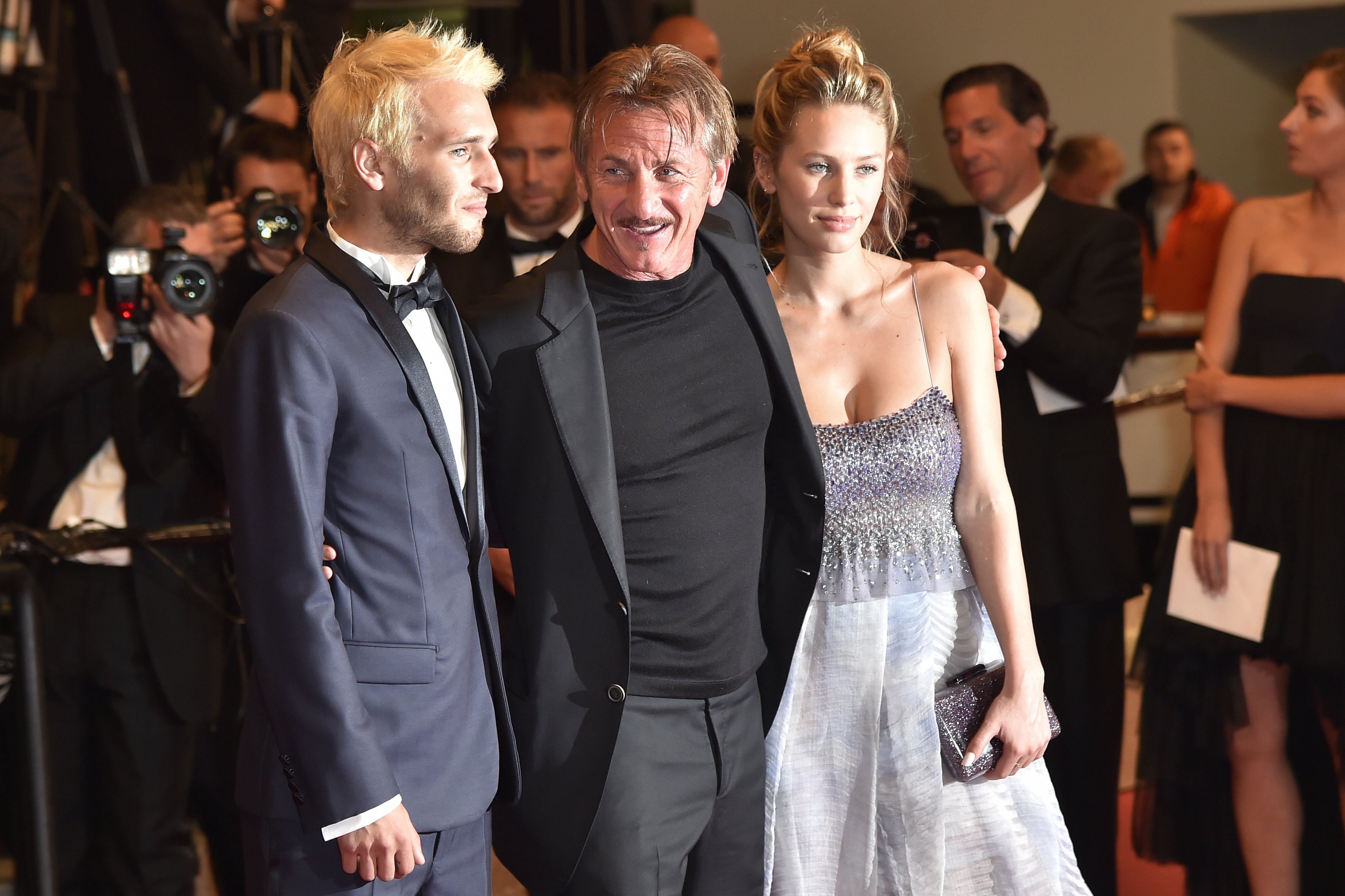 Sean Penn poses with his children Hopper Penn and Dylan Penn before leaving the Festival Palace on May 20, 2016 in Cannes, France ┃Source: Getty Images