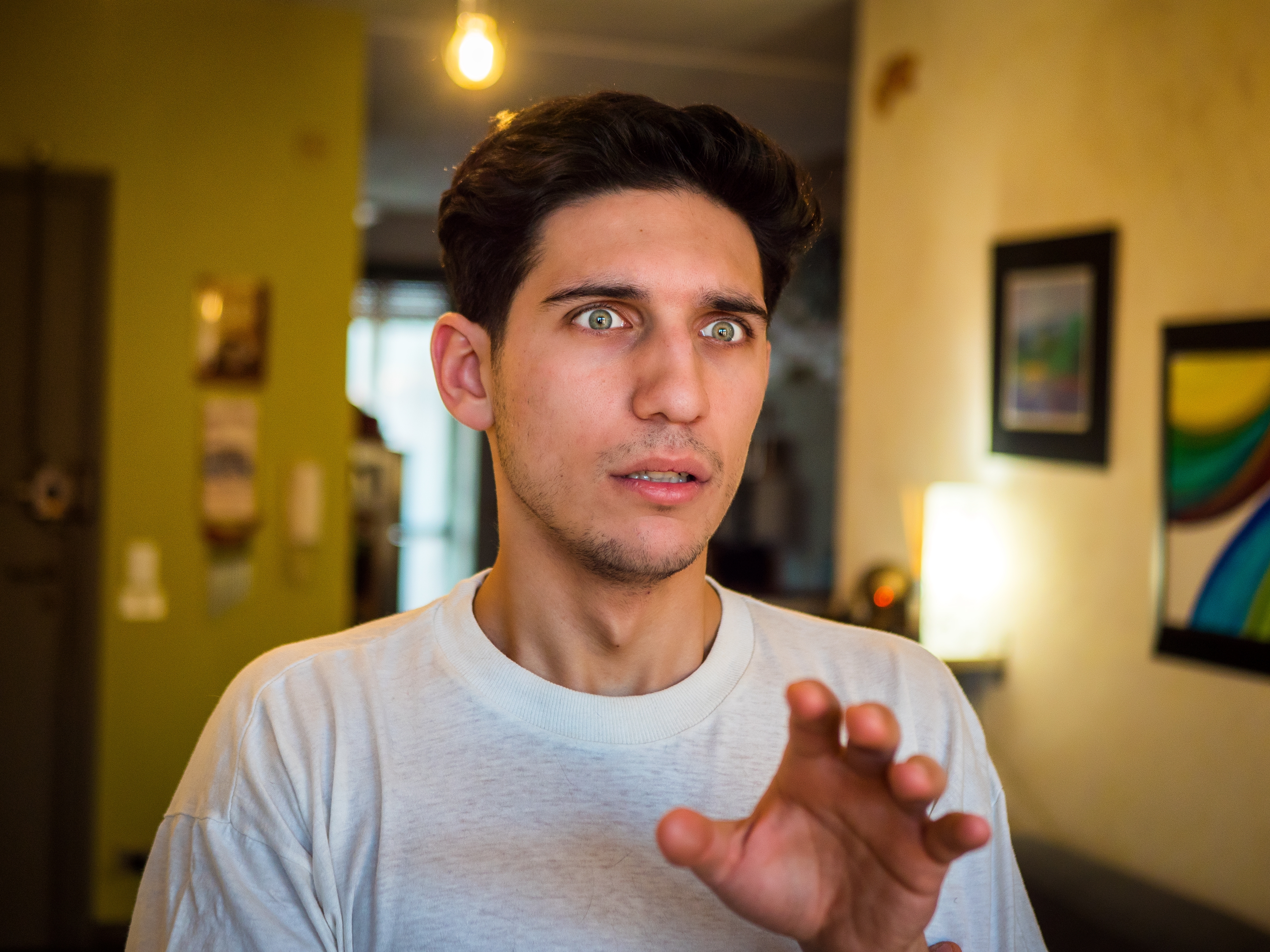 A shocked man standing inside a house | Source: Shutterstock