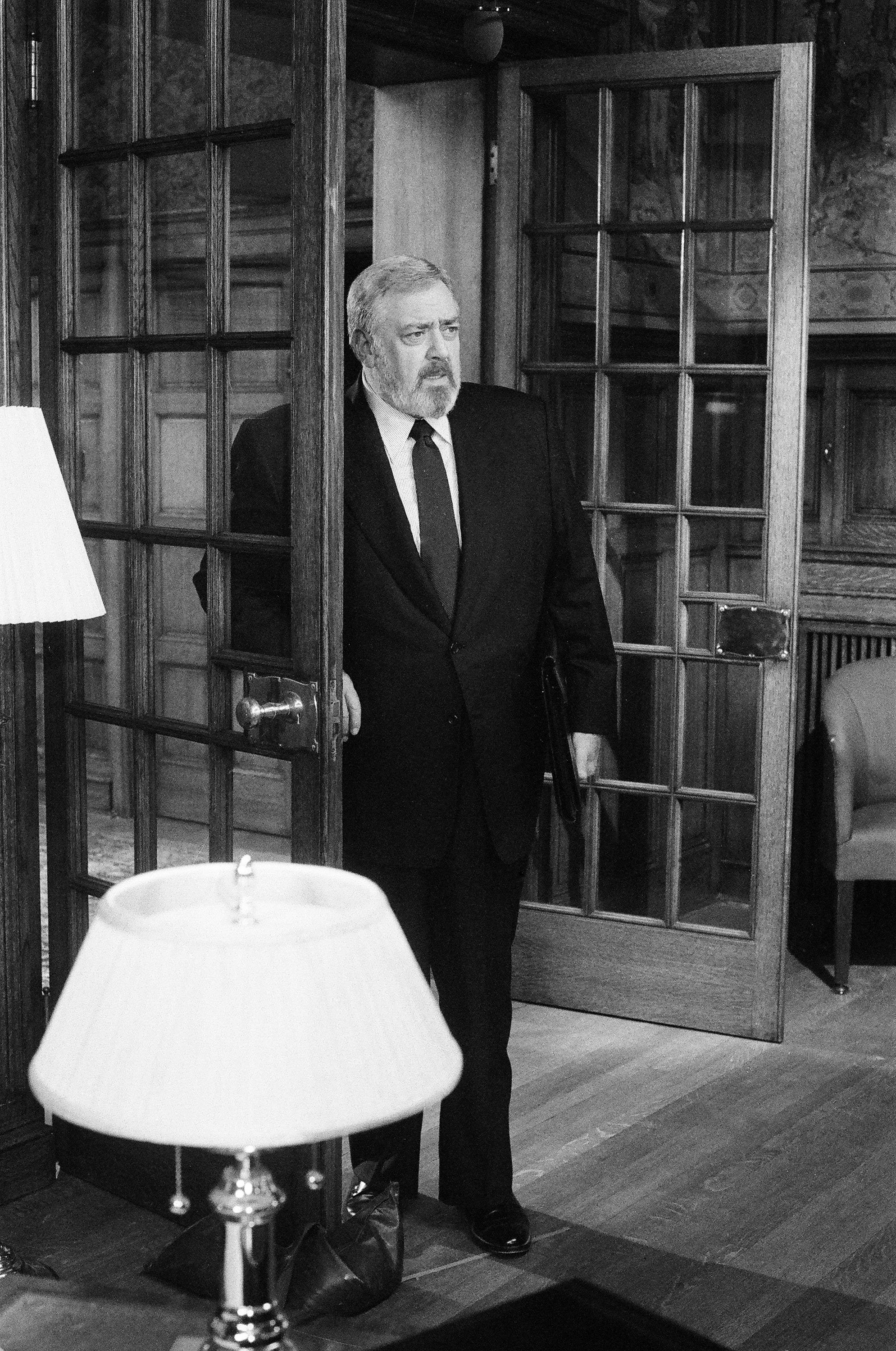 Raymond Burr standing at the door as Perry Mason in the spin-off series "Perry Mason Returns"