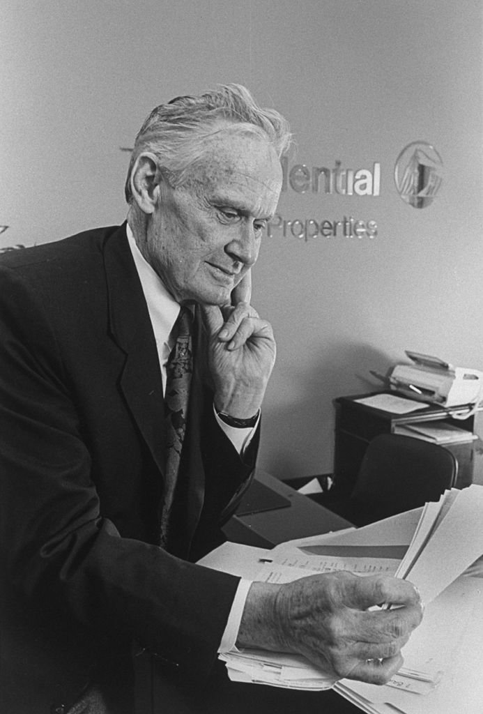 Bill Loud, former star of '73 PBS TV documentary series An American Family, posing at desk in his Prudential Texas Properties office. | Photo: Getty Images