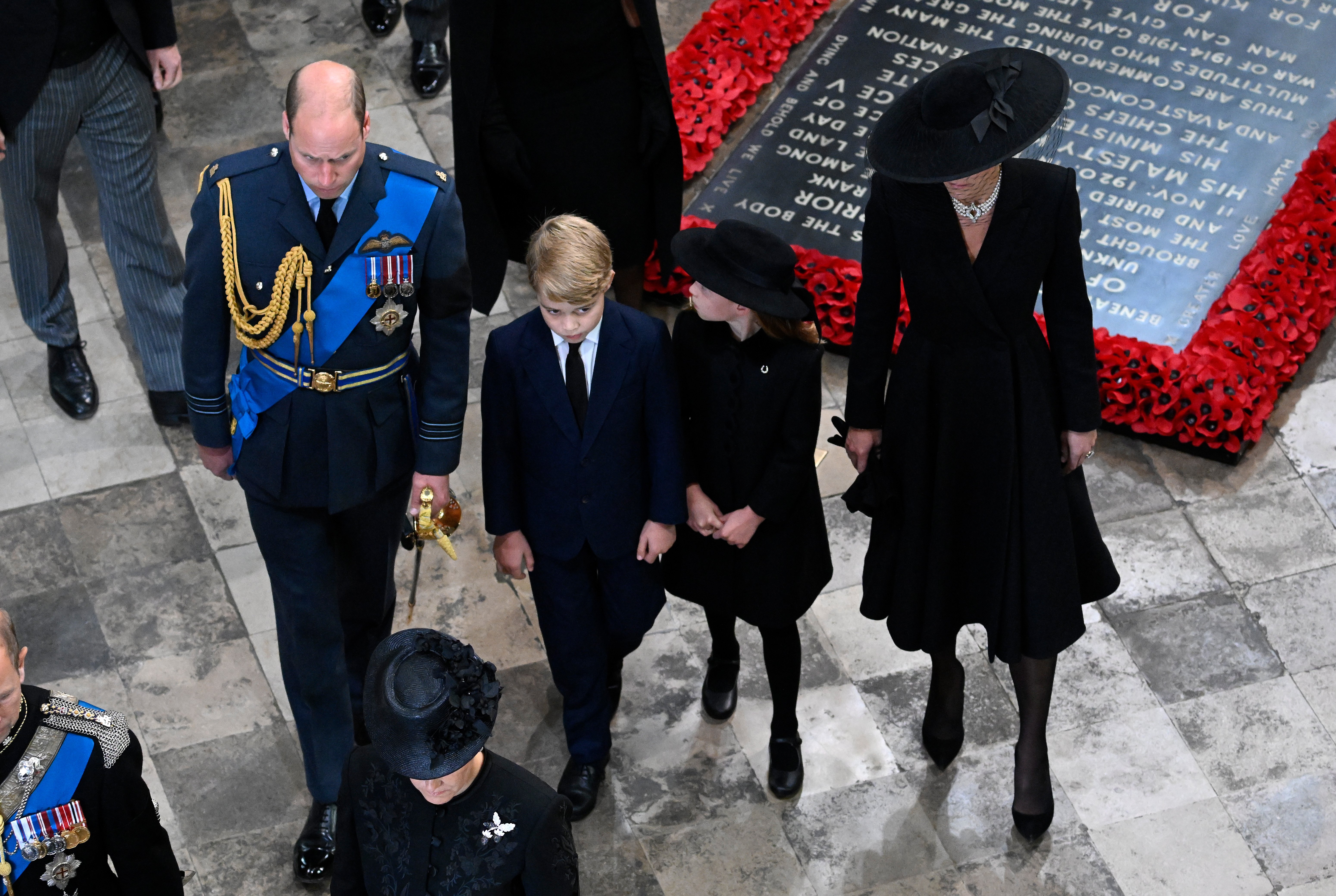 Prince William, Prince George, Princess Charlotte, and Princess Kate depart Westminster Abbey during the State Funeral of Queen Elizabeth II on September 19, 2022, in London, England | Source: Getty Images