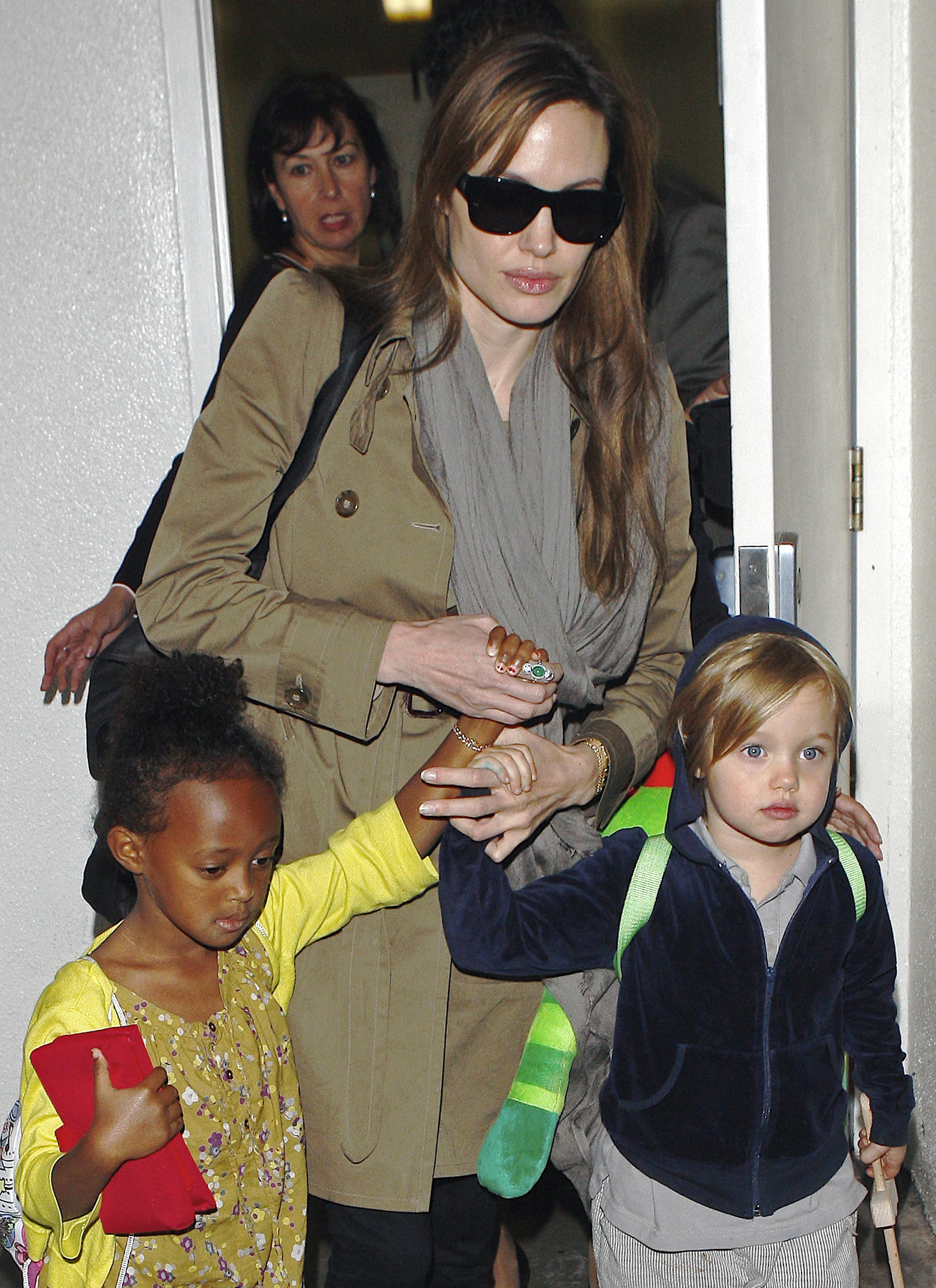 Angelina Jolie, Shiloh and Zahara arrive at LAX Airport on September 18, 2010 in Los Angeles, California. | Source: Getty Images