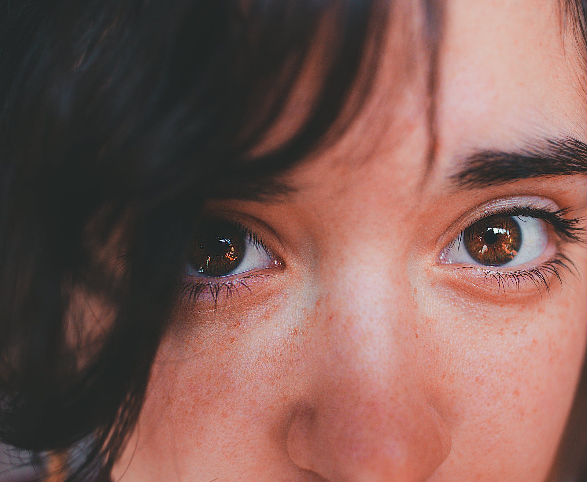 Close up of a woman with tear-filled eyes | Source: Pexels