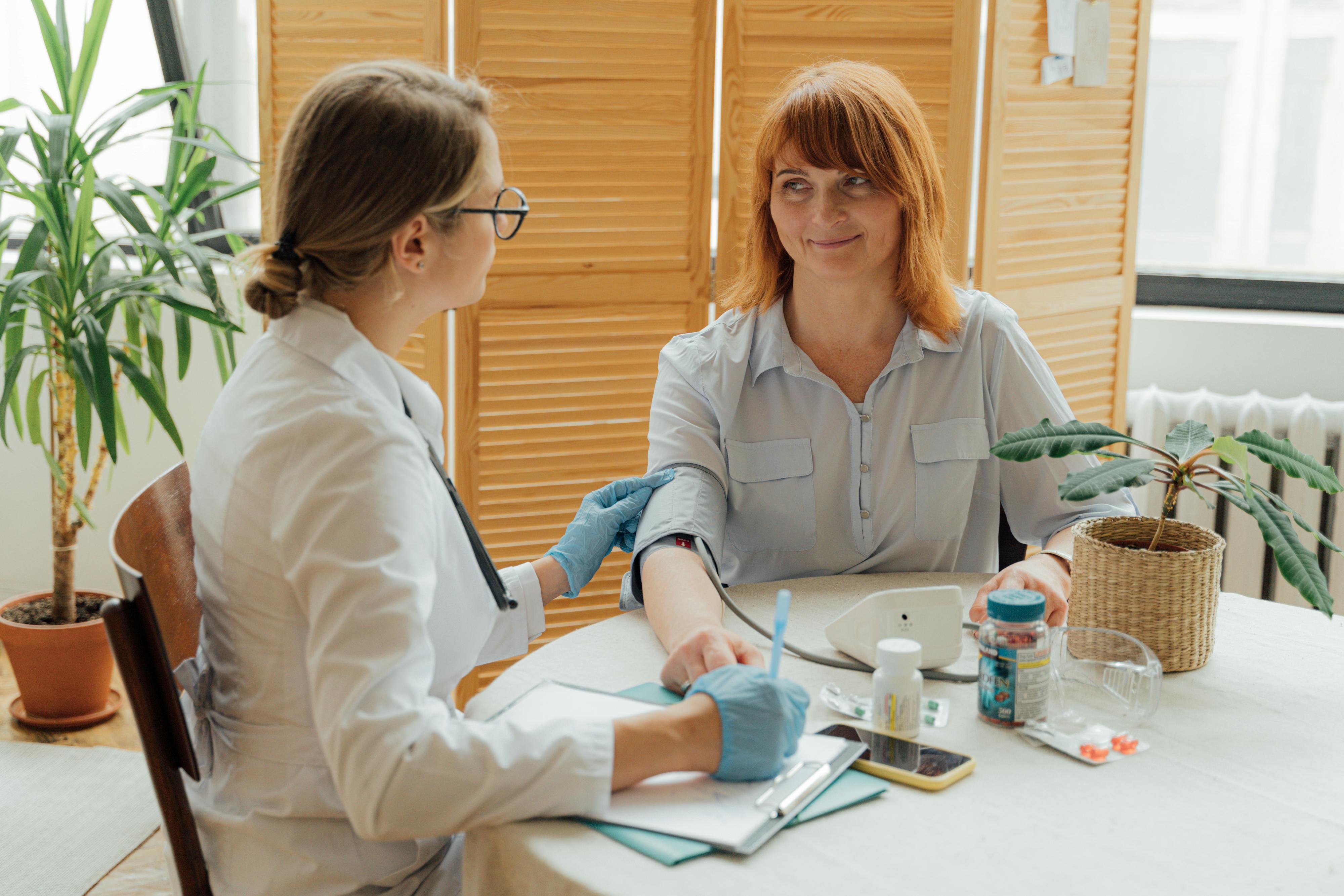 A woman having her blood pressure checked | Source: Pexels