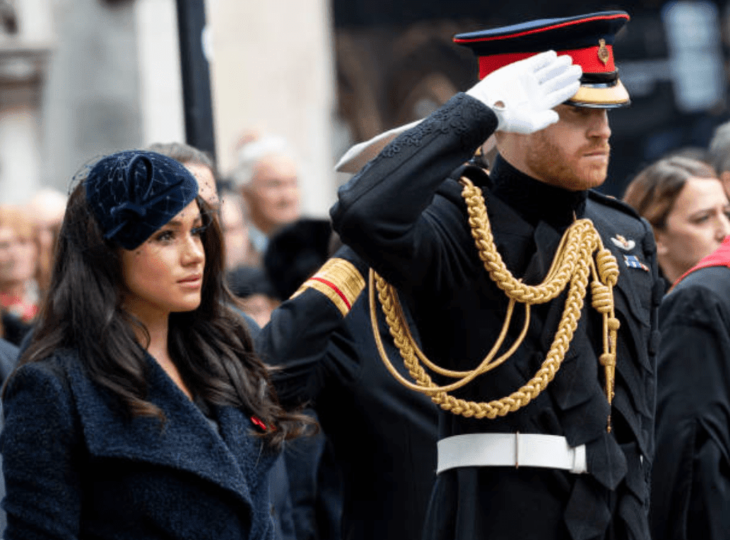 Meghan Markle stands with Prince Harry as he salutes the 91st Field of Remembrance at Westminster Abbey, on November 7, 2019 in London, England | Source: Mark Cuthbert/UK Press via Getty Images