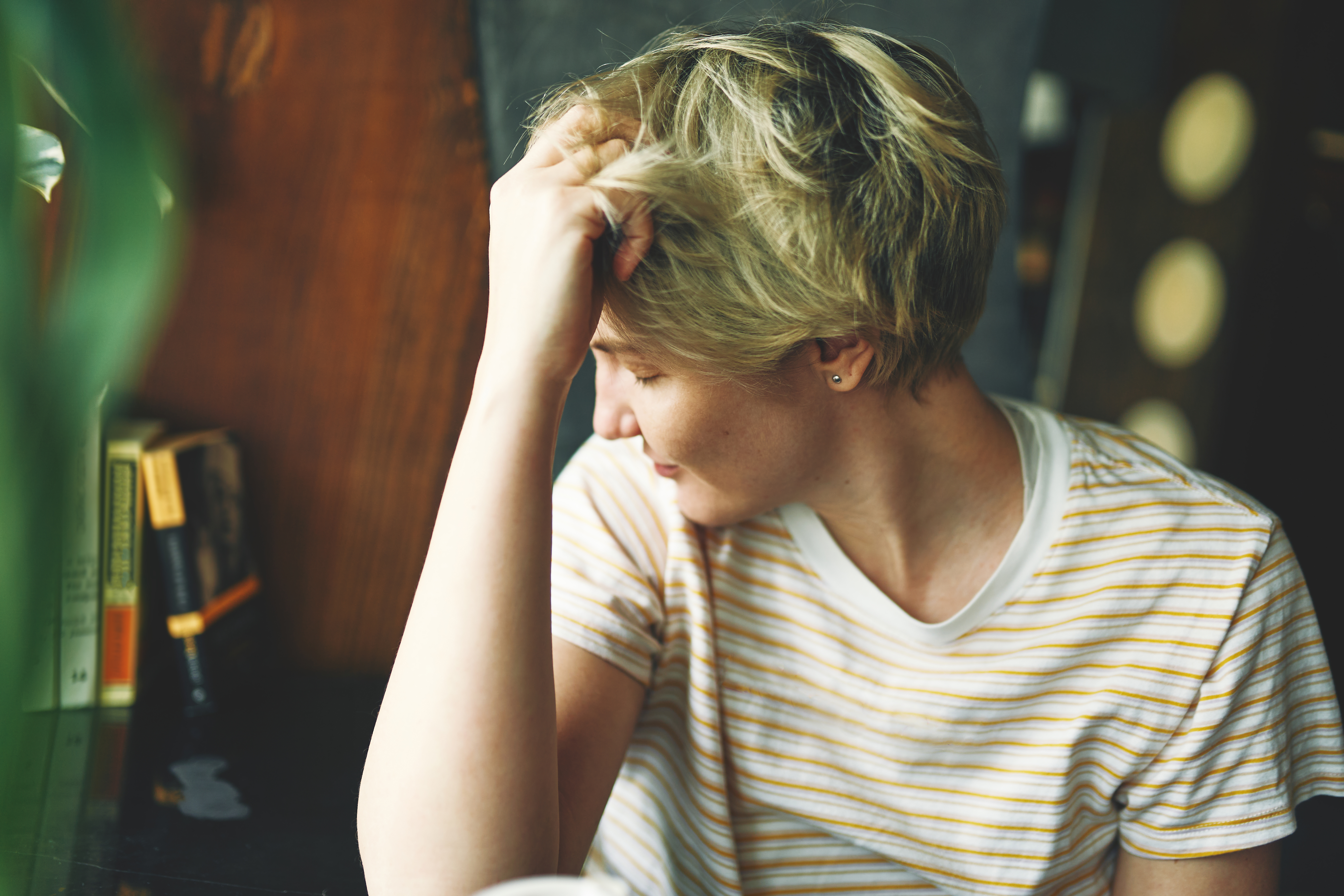 A tired woman with a headache clutched her head | Source: Getty Images