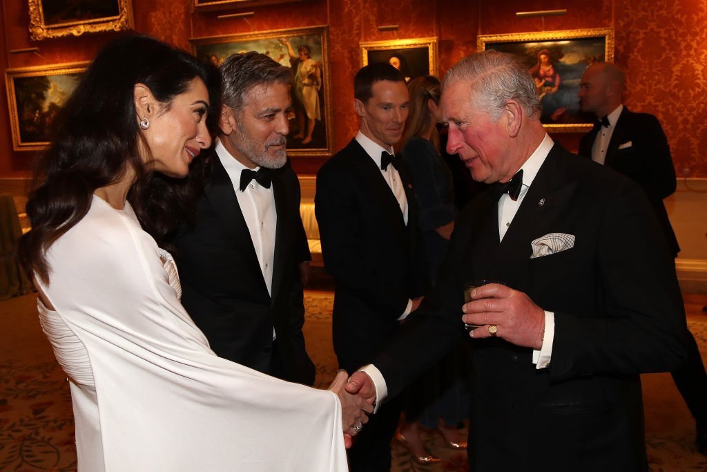 Amal Clooney and George Clooney attend a dinner to celebrate The Prince's Trust at Buckingham Palace on March 12, 2019 | Photo: Getty Images