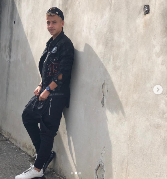 Luca Manolache posing against a wall, from a post dated October 4, 2020 | Source: Instagram/manolache_luca10