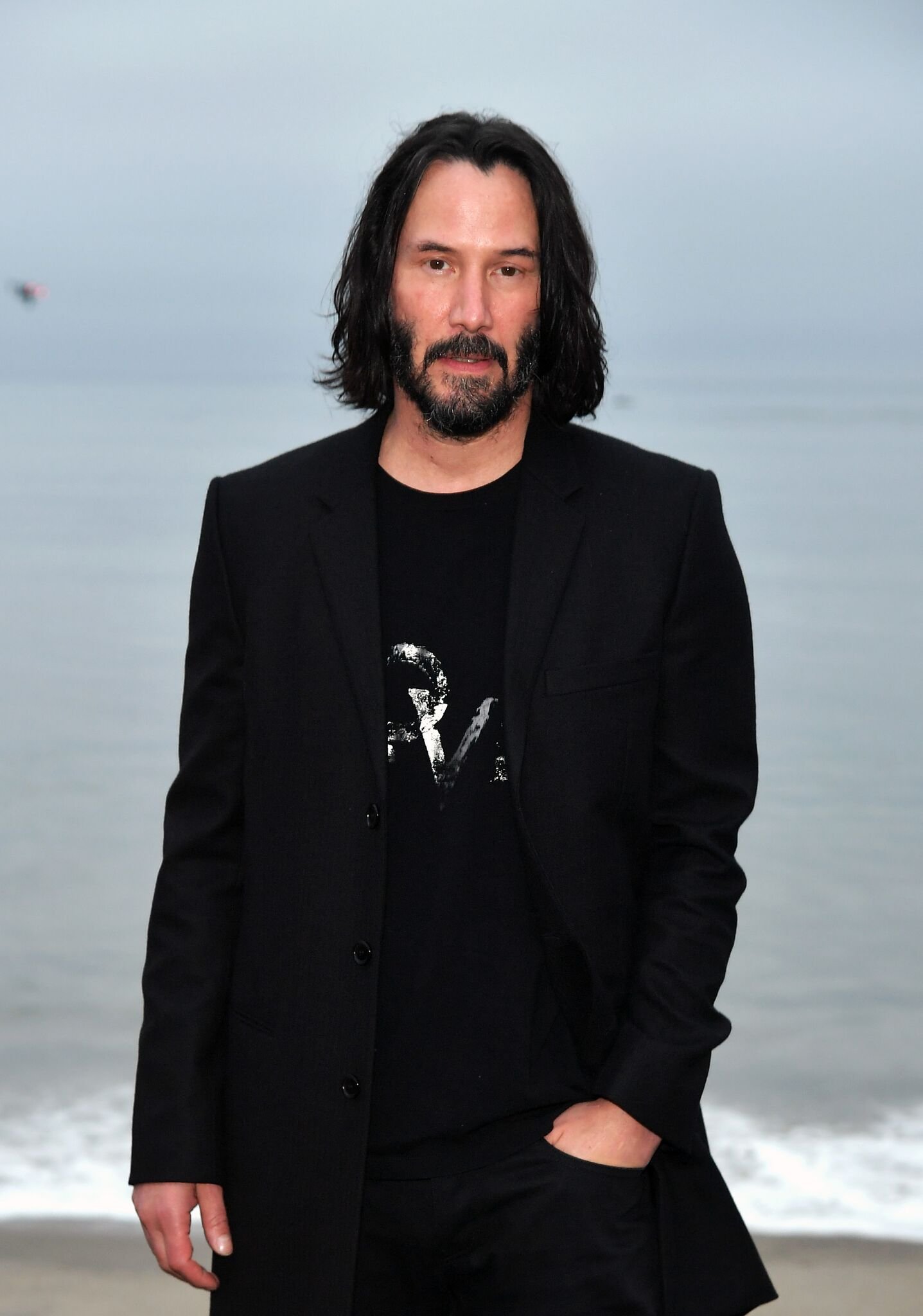 Keanu Reeves at the Saint Laurent Mens Spring Summer 20 Show on June 06, 2019 in Paradise Cove Malibu, California | Photo: Getty Images