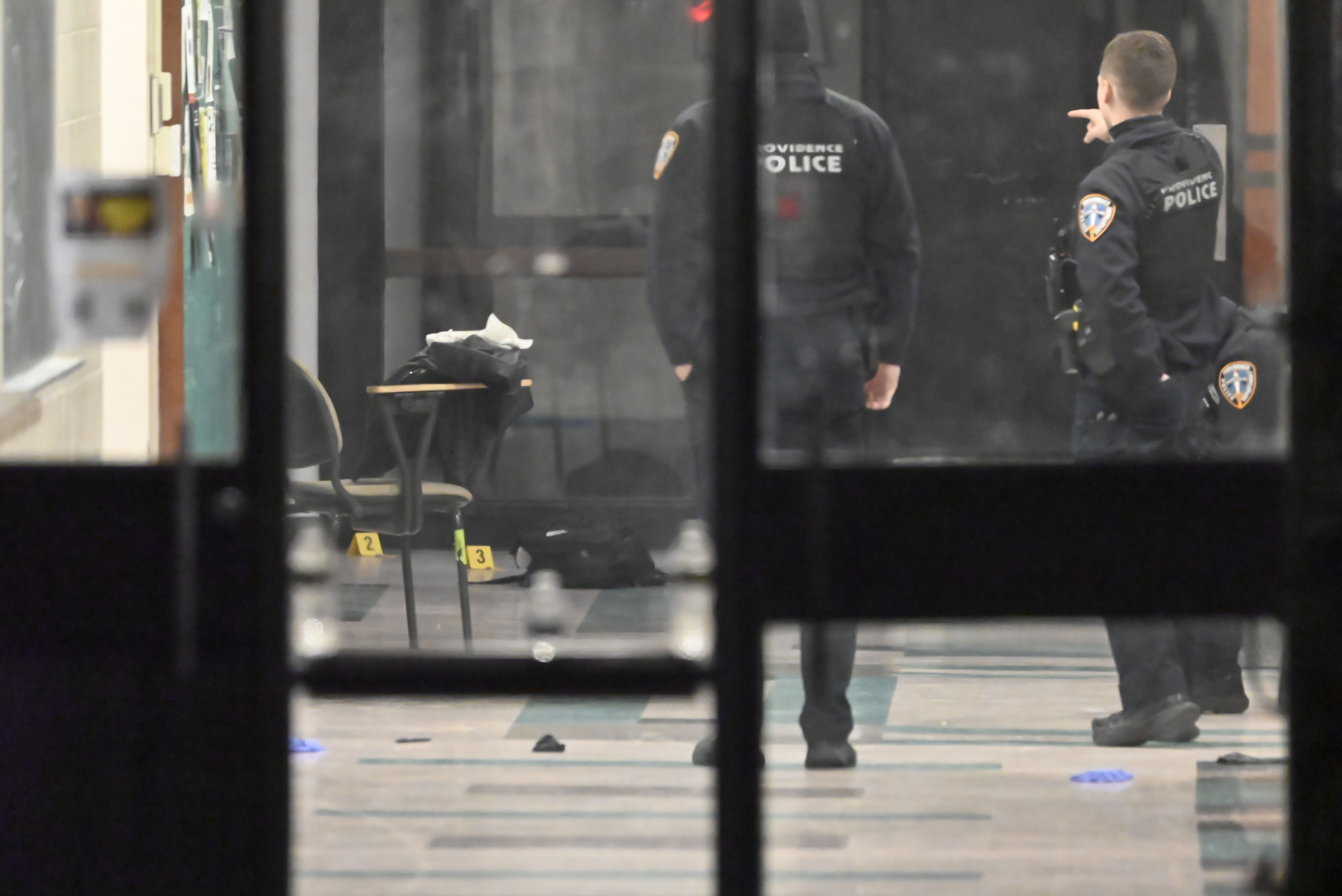 Evidence markers highlight shell casings inside a building at Brown University on December 14, 2025, in Providence, Rhode Island, following a mass shooting | Source: Getty Images
