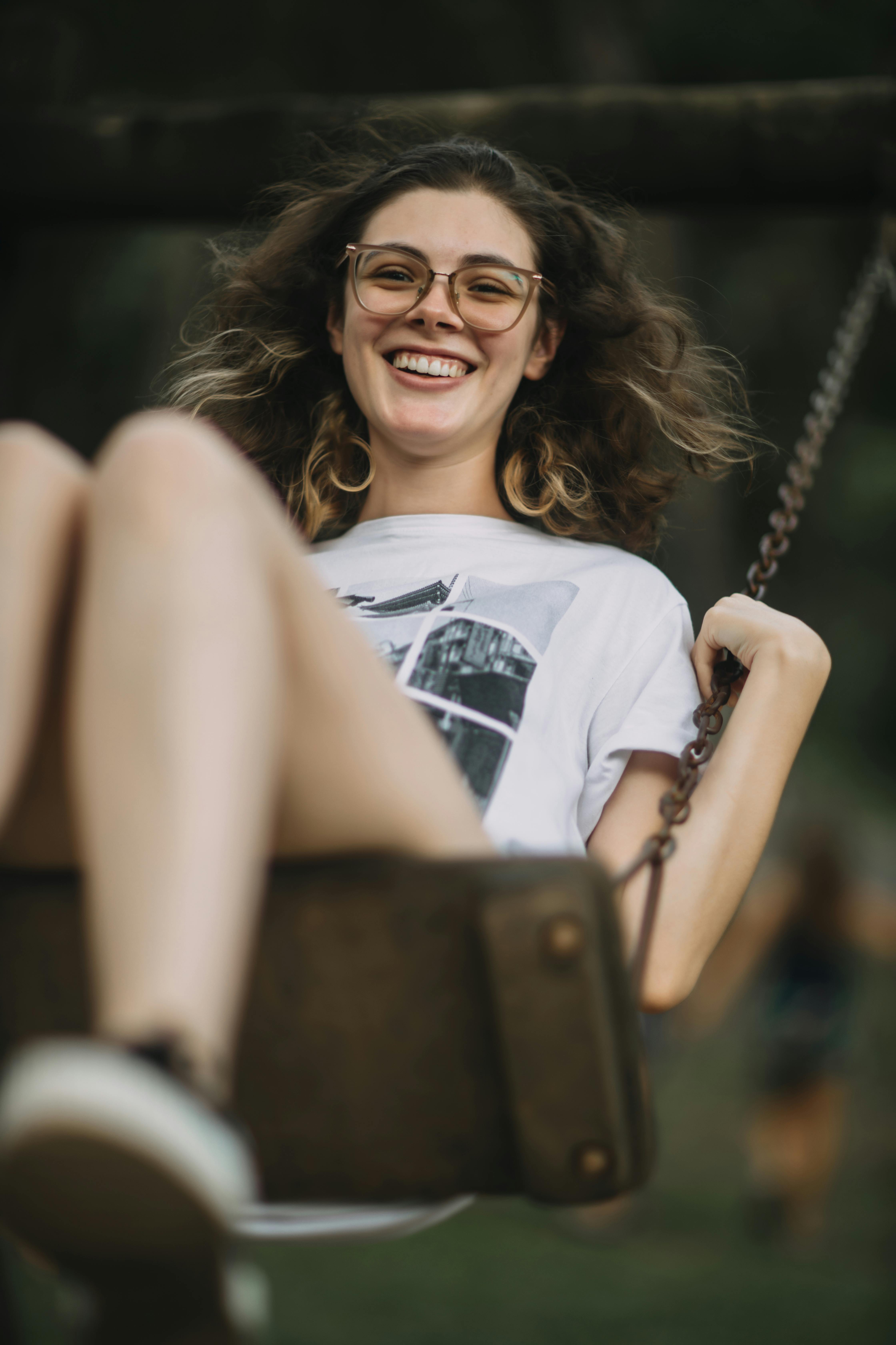 Teenage girl on a swing | Source: Pexels