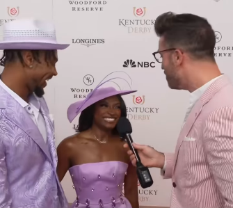 Jonathan Owens and Simone Biles chatting with an E! News reporter. | Source: Instagram/enews