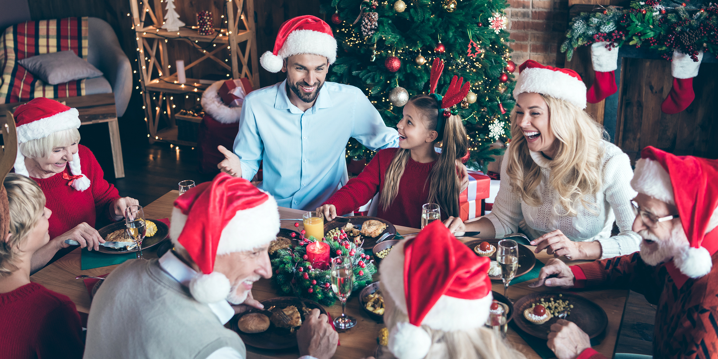 Cheerful people celebrating Christmas | Source: Shutterstock