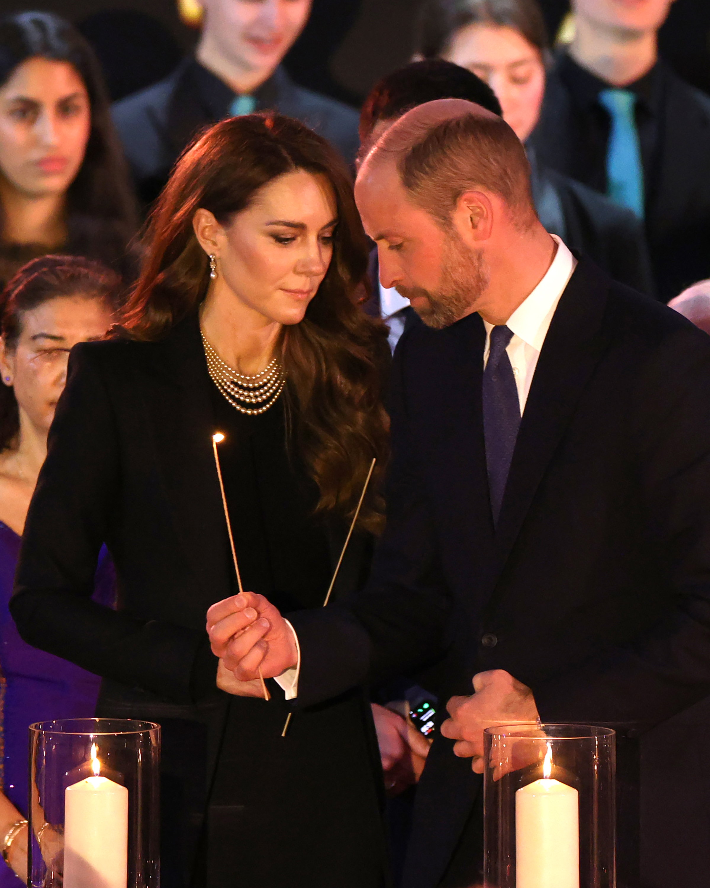 Catherine, Princess of Wales and Prince William, Prince of Wales light candles during a ceremony commemorating Holocaust Memorial Day in London, England, on January 27, 2025 | Source: Getty Images