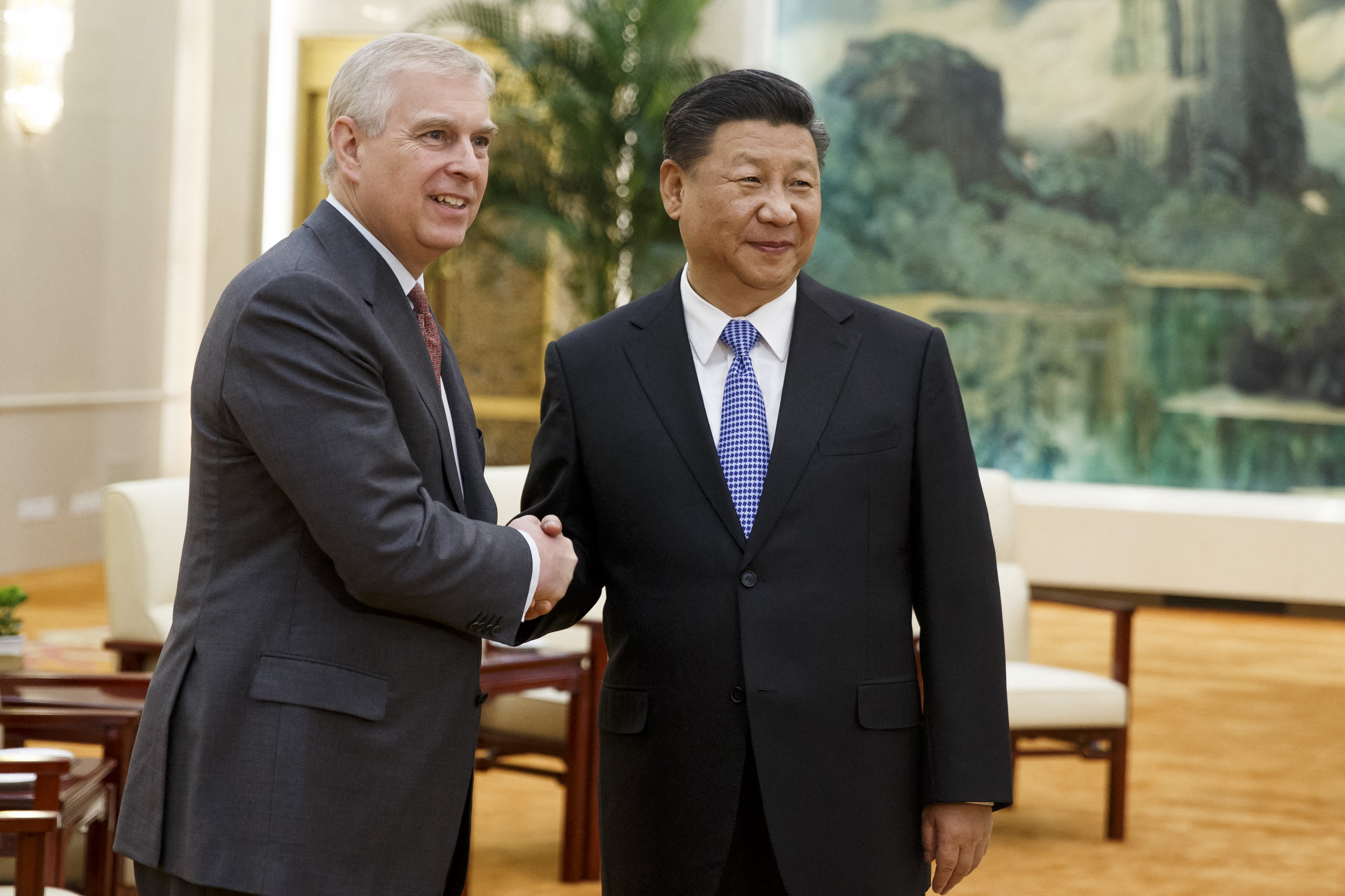 Andrew Mountbatten-Windsor and Xi Jinping shake hands at the Great Hall of the People on May 29, 2018, in Beijing, China. | Source: Getty Images