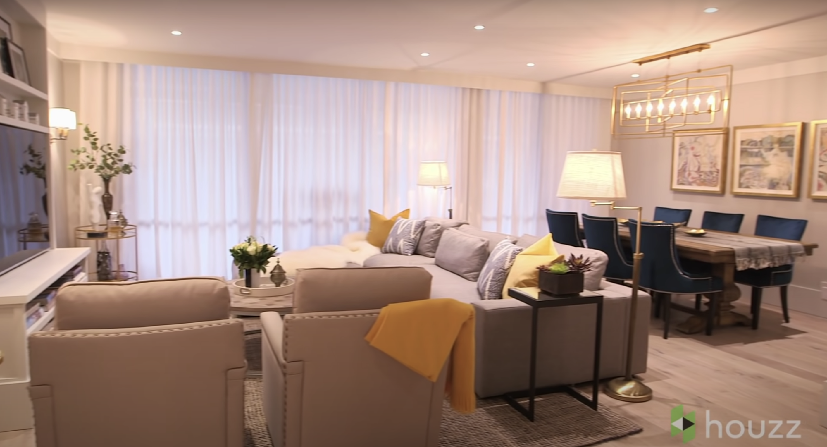 The new and spruced-up living room of Mila Kunis' family condo | Source: Youtube.com/HouzzTV