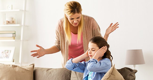 Two woman are arguing. One has her hands over her ears, while the other shouts. | Photo: Shutterstock