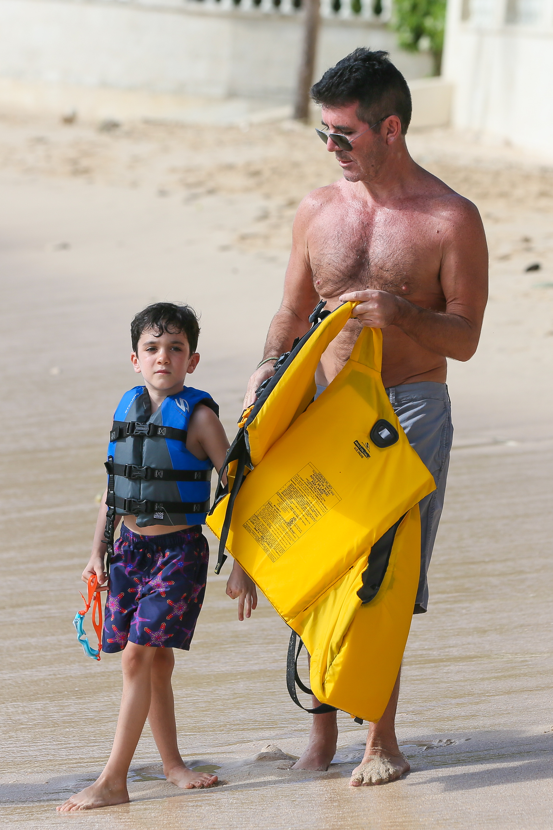 Simon and Eric Cowell seen in Bridgetown, Barbados, on December 22, 2019. | Source: Getty Images