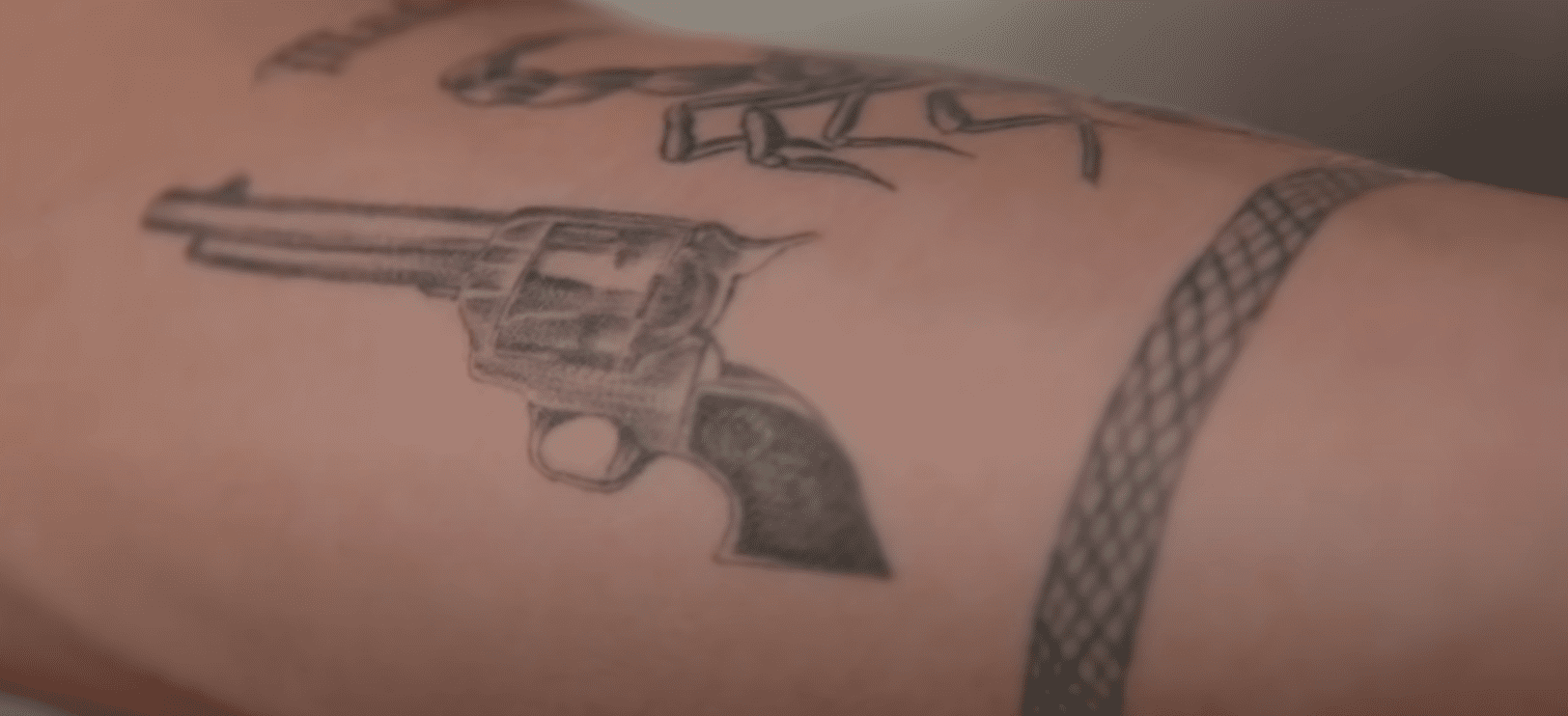 Vinnie Hacker's gun tattoo | Source: YouTube/ Inked