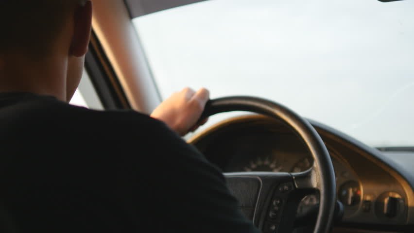 A young man driving a car | Photo: Shutterstock