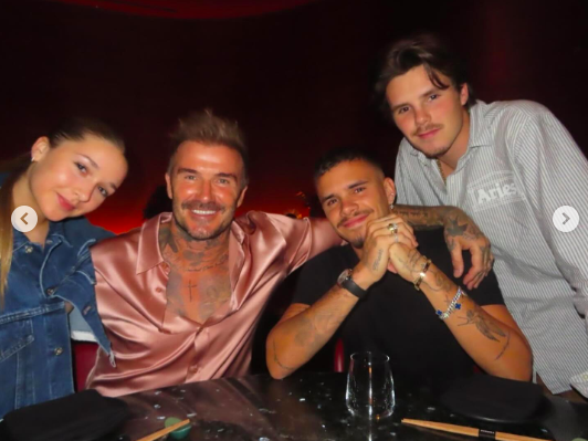 Harper, David, Romeo and Cruz Beckham posing for a photo during Romeo Cruz's birthday celebration, posted on September 3, 2024 | Source: Instagram/victoriabeckham